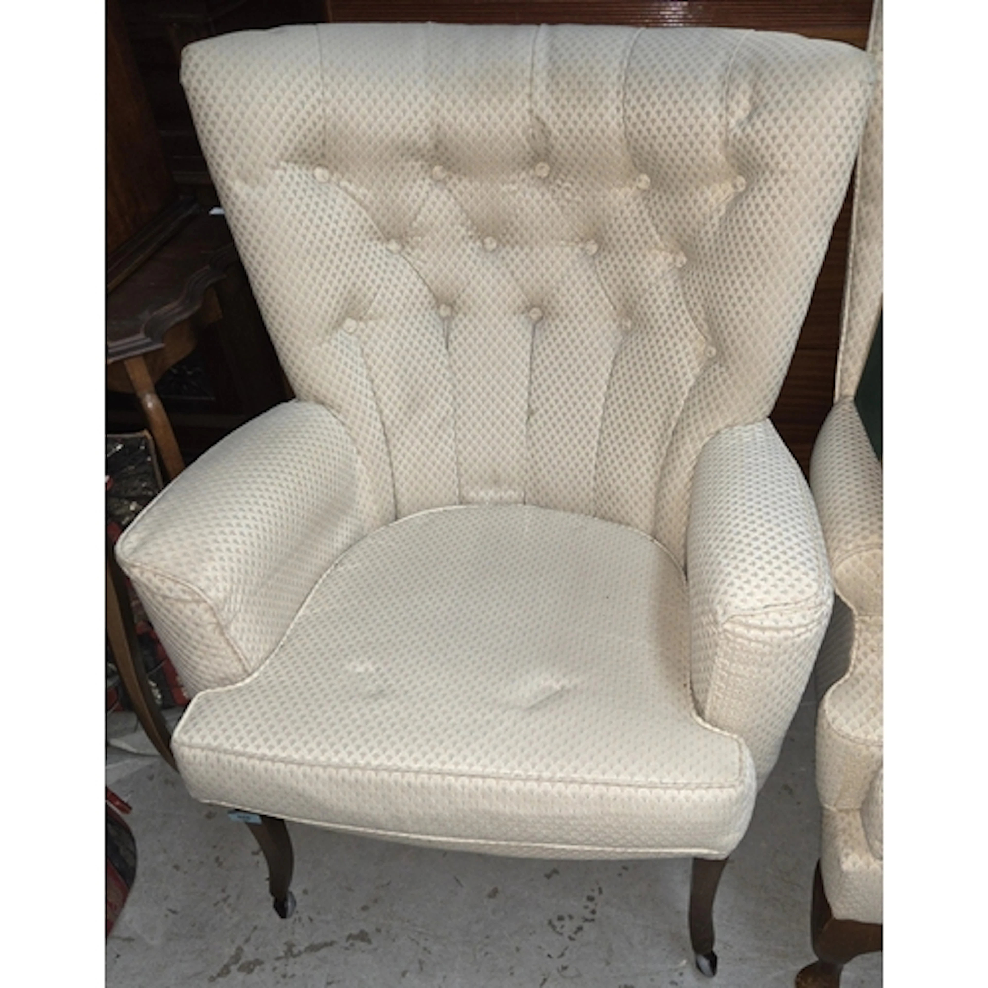 A button back armchair in Art Deco upholstery.