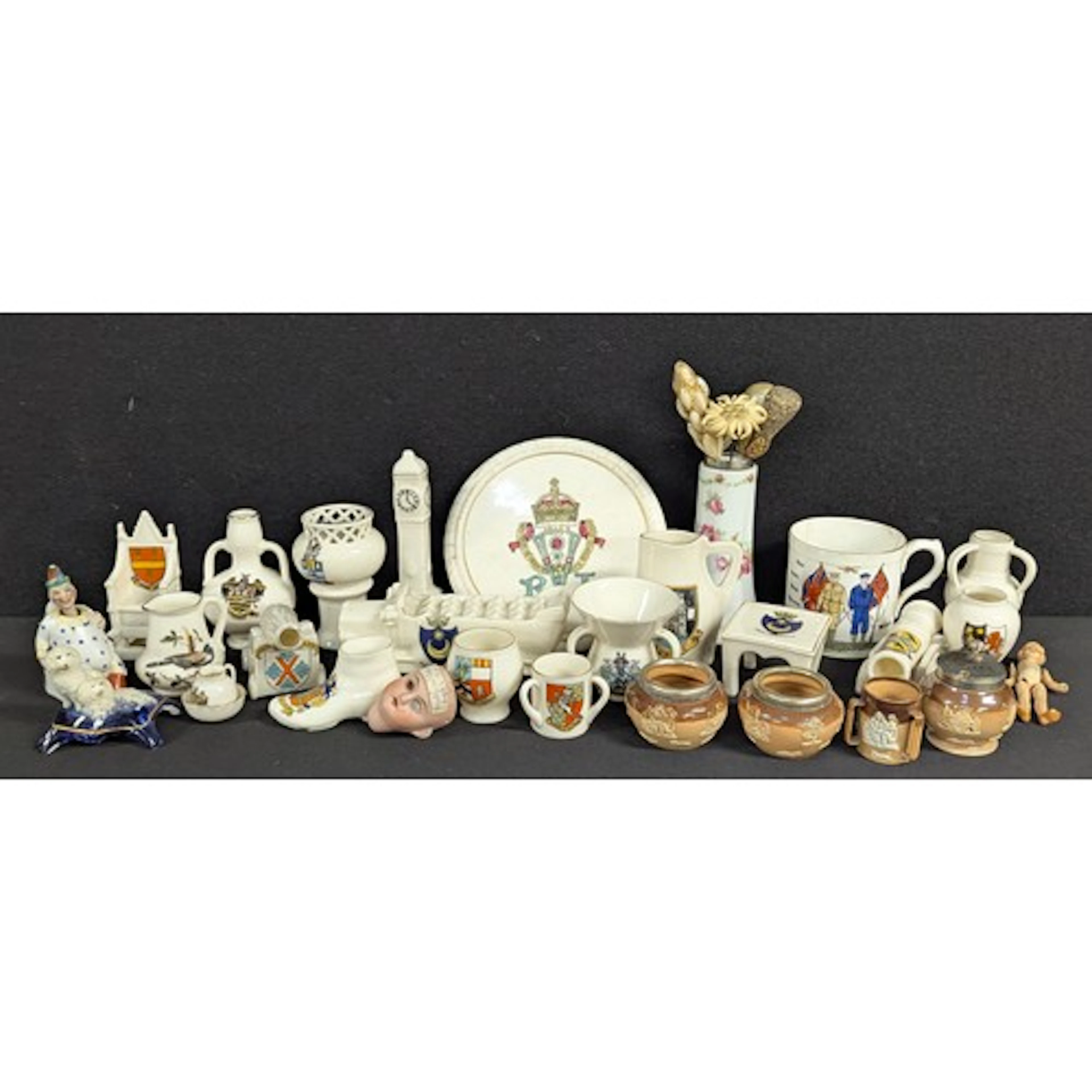A miniature ceramic German jointed doll, 8cm, number 5588, c...