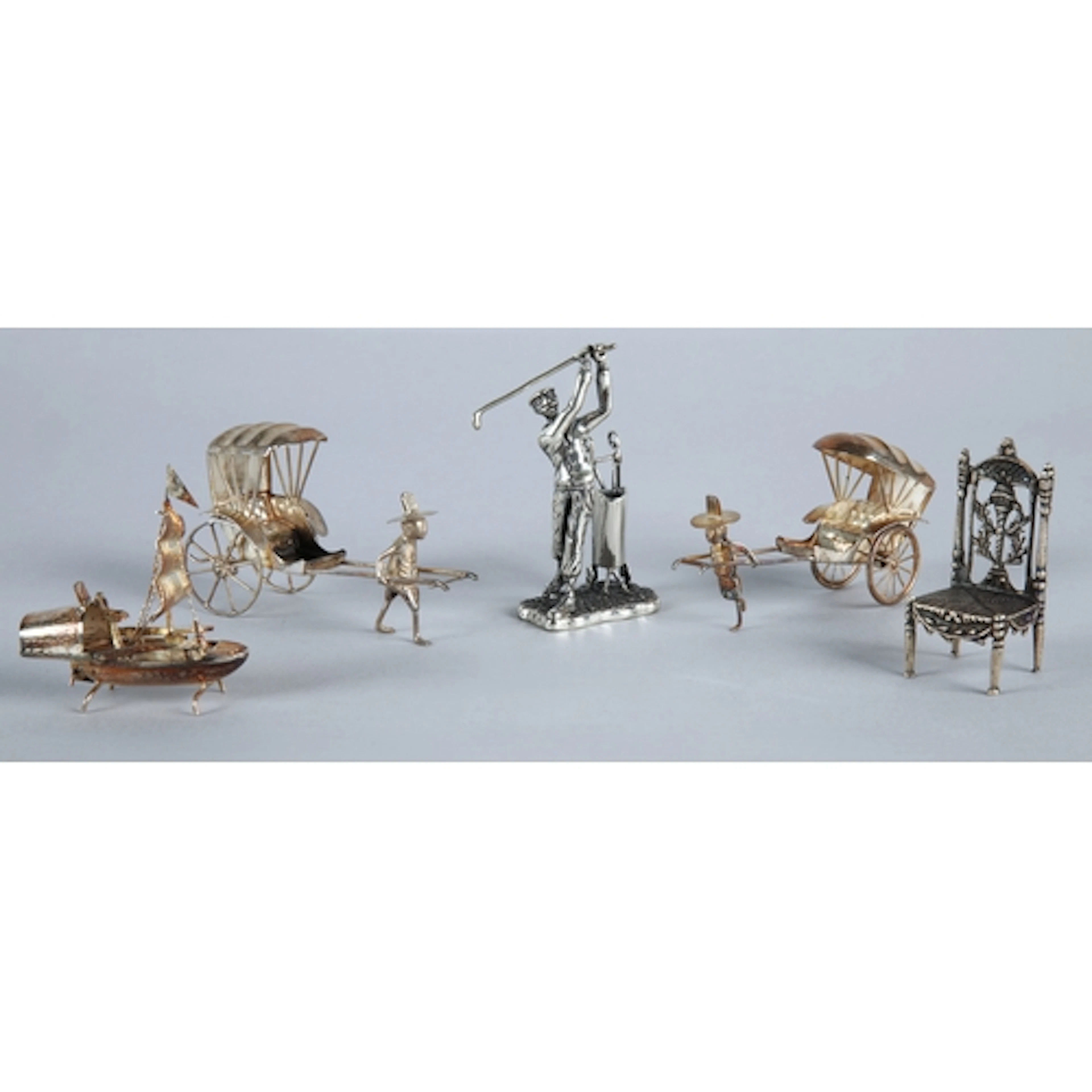 Two Chinese export silver miniature rickshaw and driver grou...