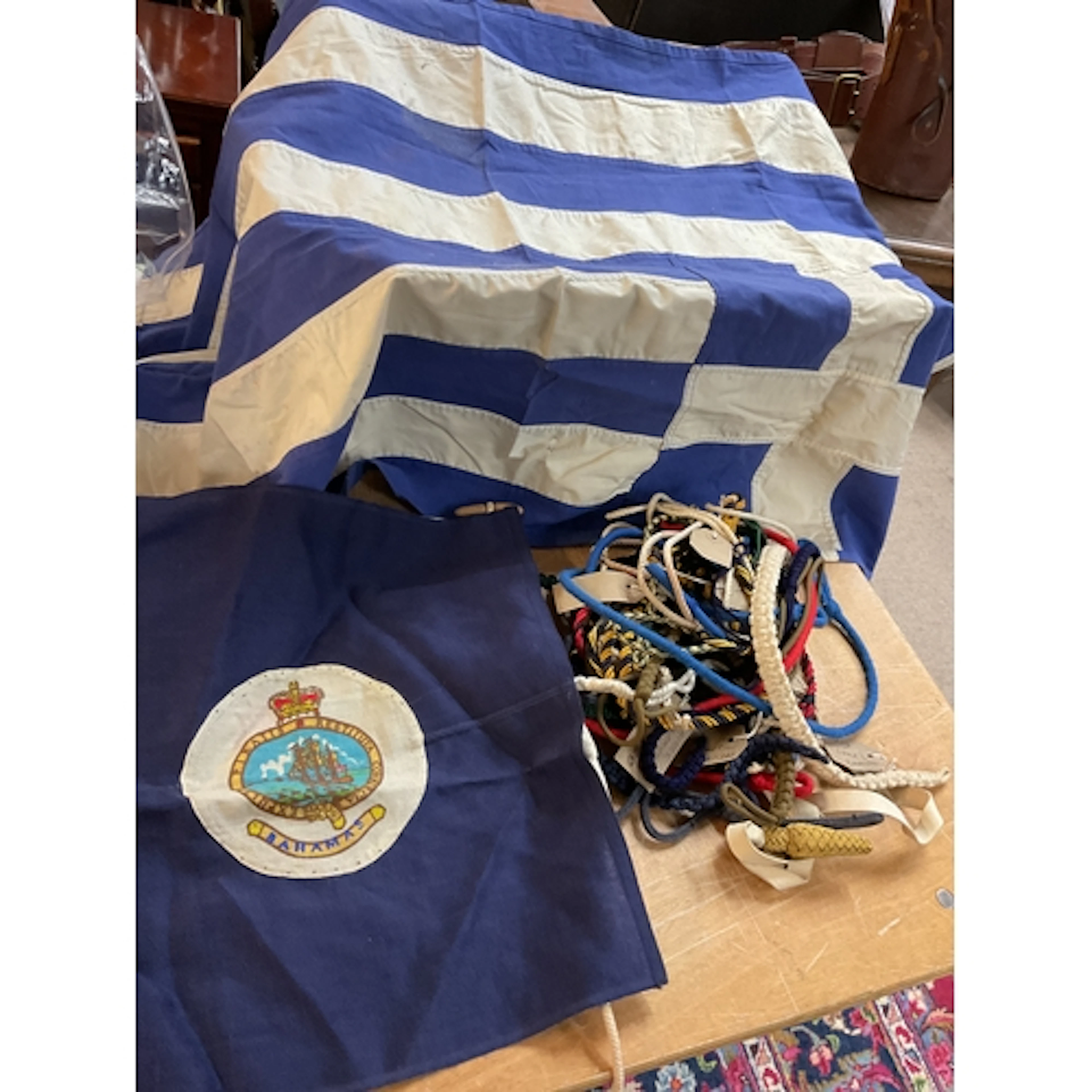Qty of military lanyards and Greek and Bahamian flag.