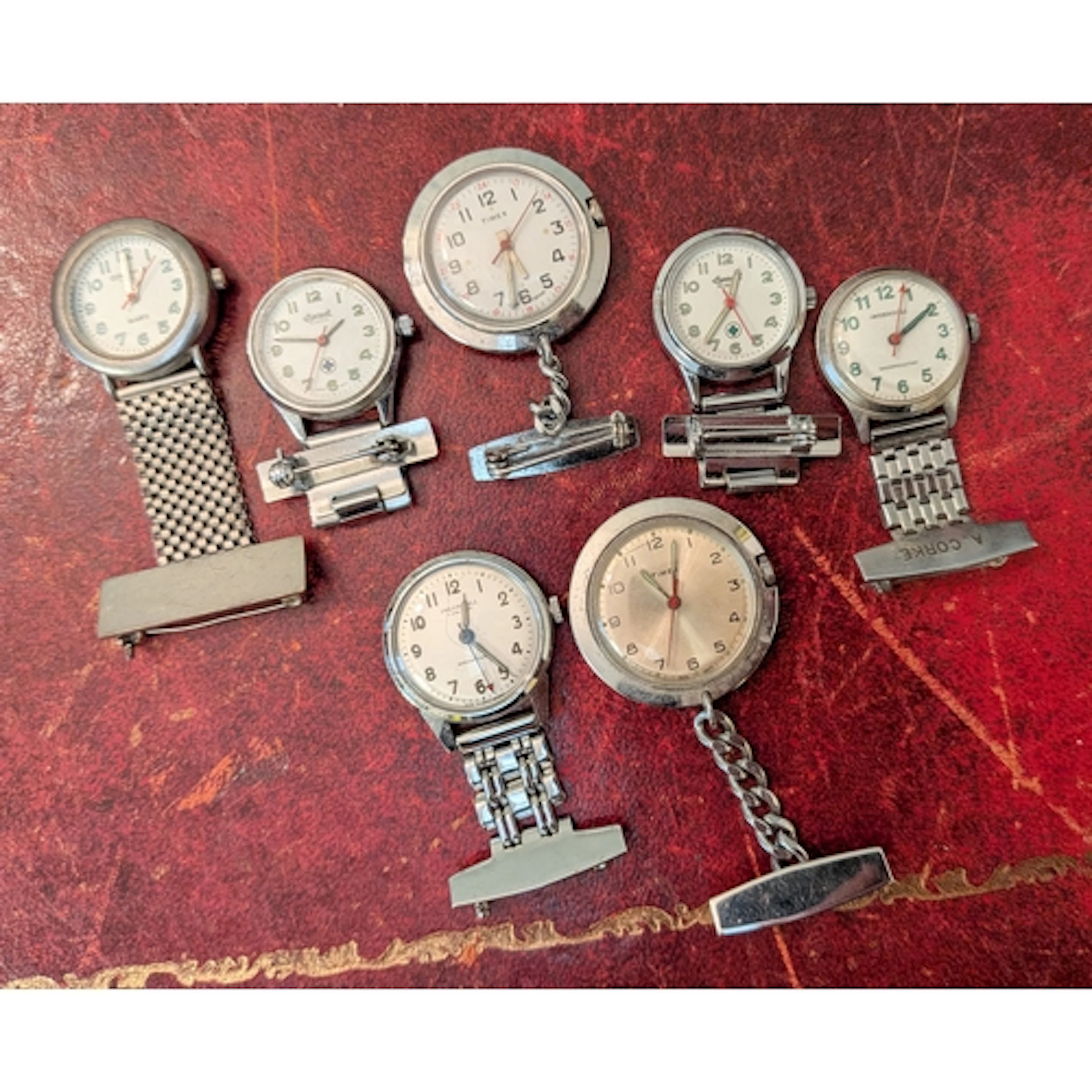 A collection of seven nurses fob watches to include Timex an...