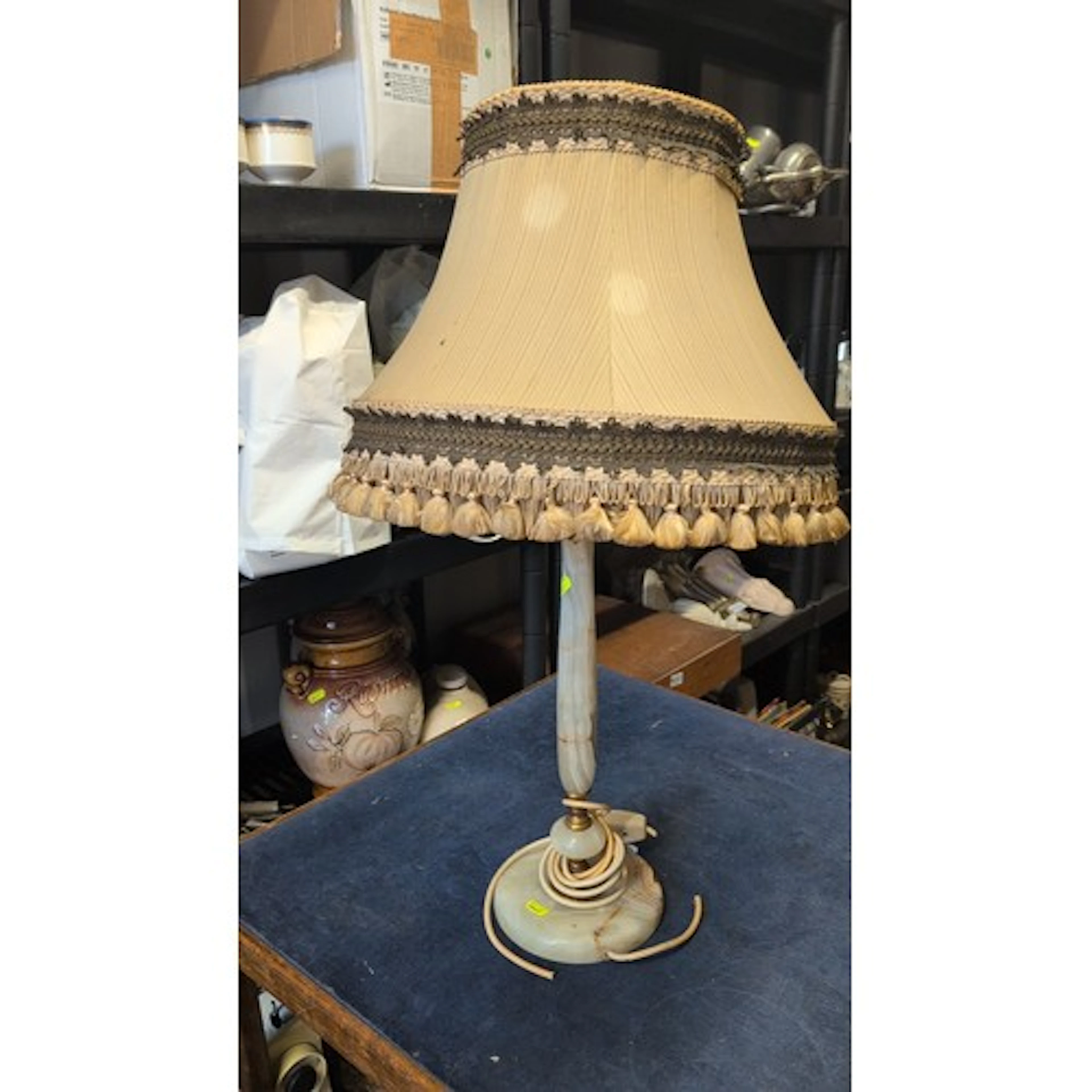 A vintage table lamp with green veined onyx column and domed...