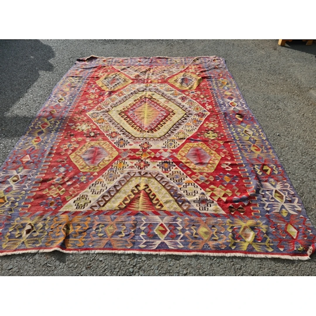 A large multi-coloured Kelim with central octagonal medallio...