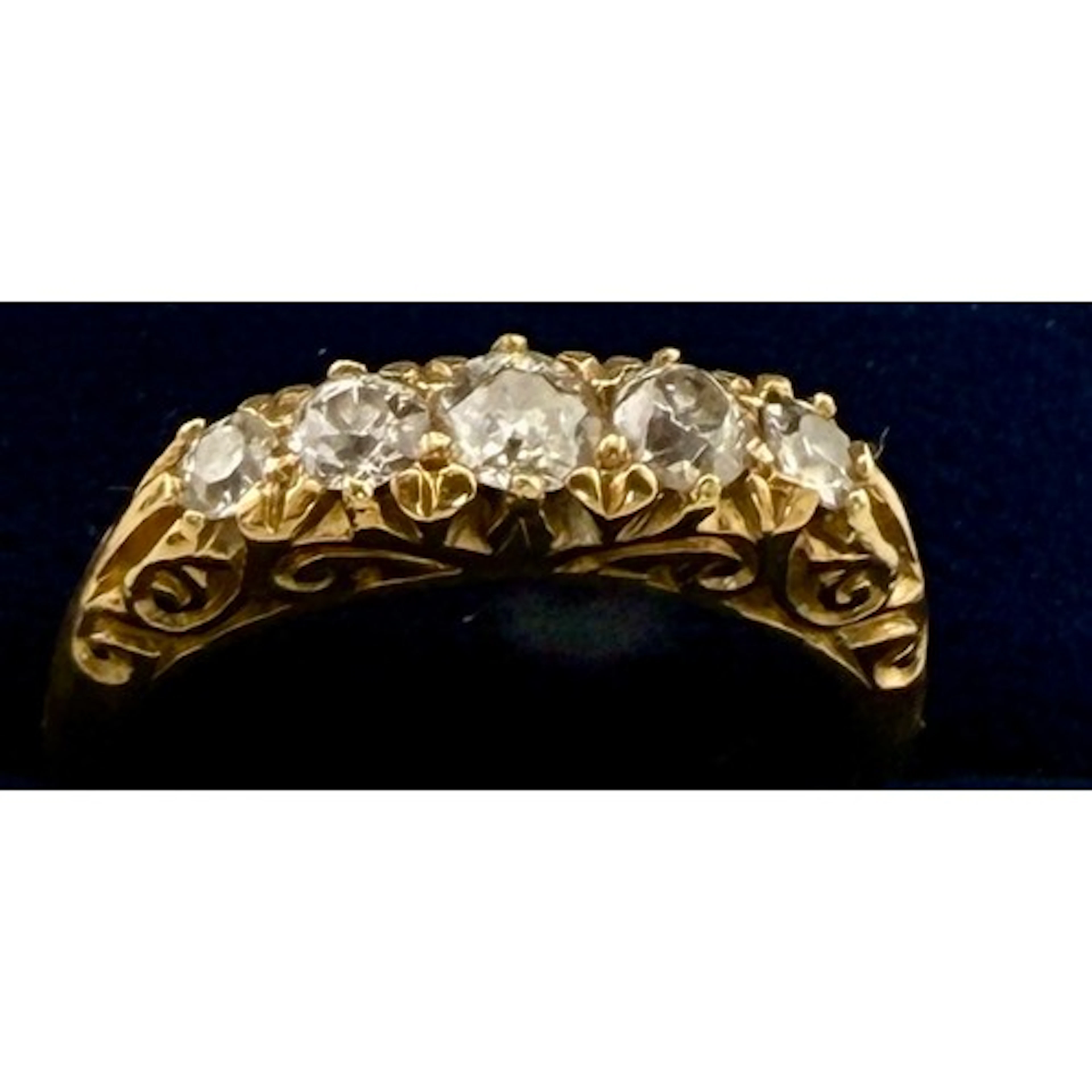 An 18 carat gold five stone diamond ring. Size M. Weight 3.8...