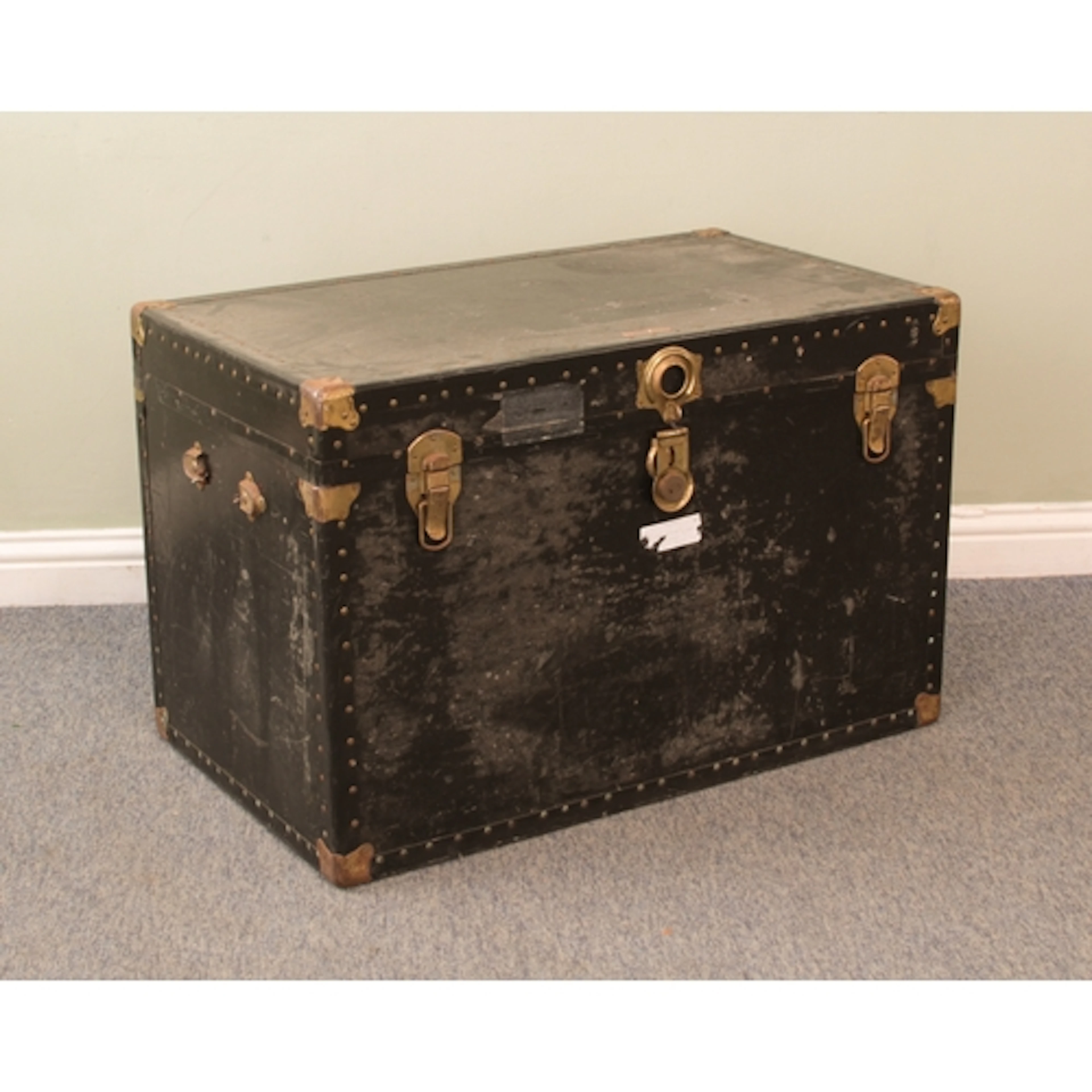 A large vintage school or steamer trunk - black painted with...