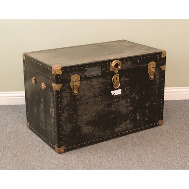A large vintage school or steamer trunk - black painted with...
