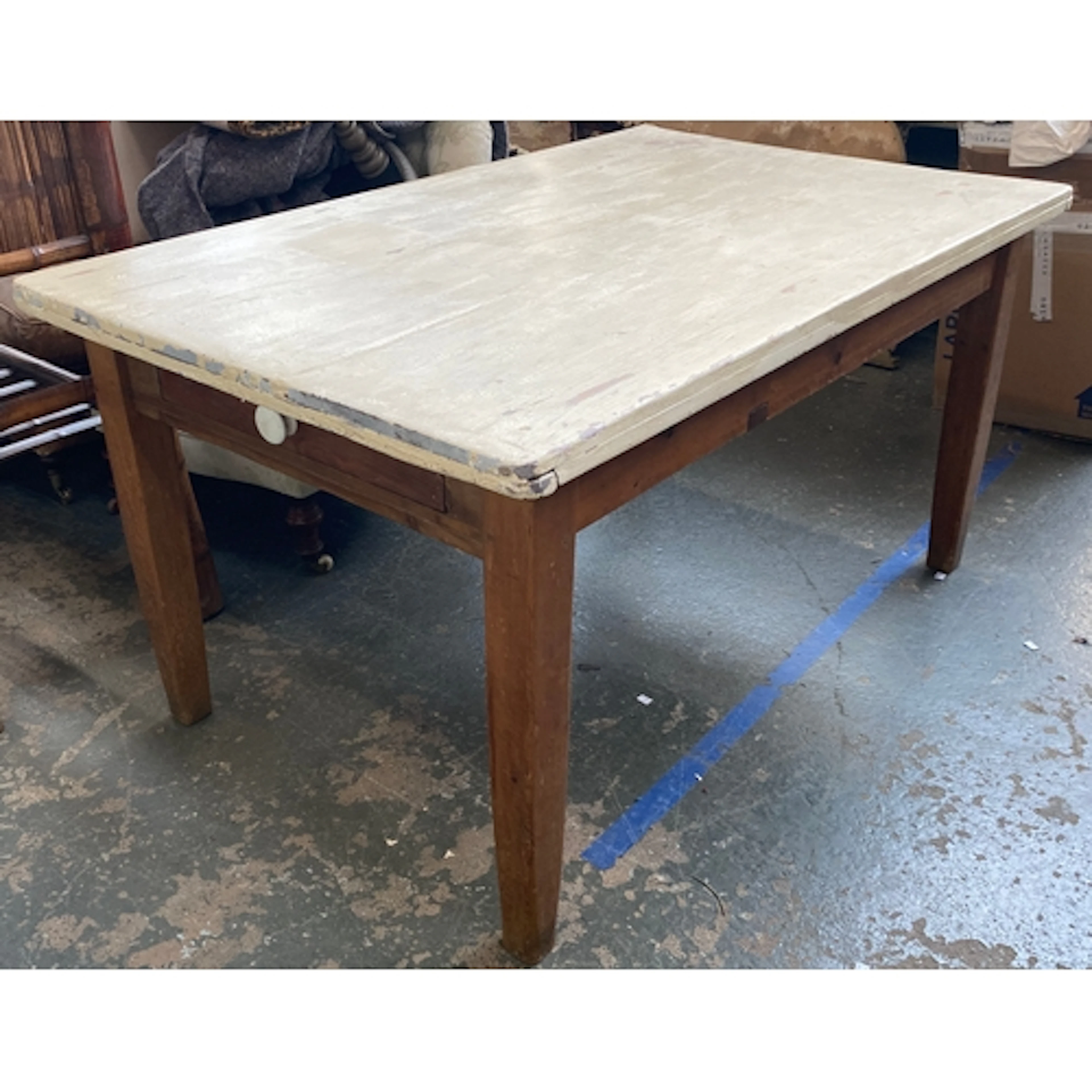 A pine kitchen table with white painted top and single end d...