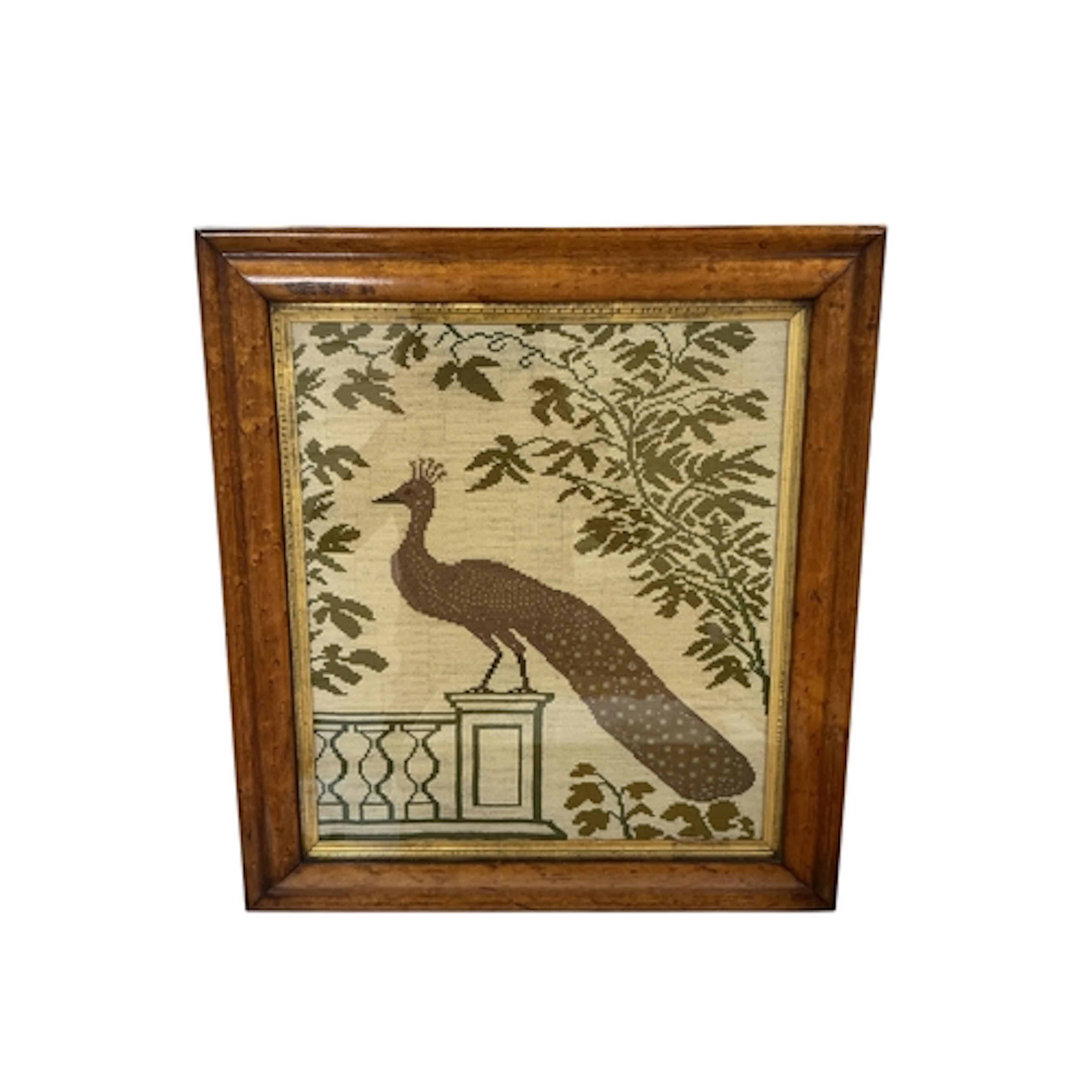 A late 19th century wool worked panel of a Peacock standing ...