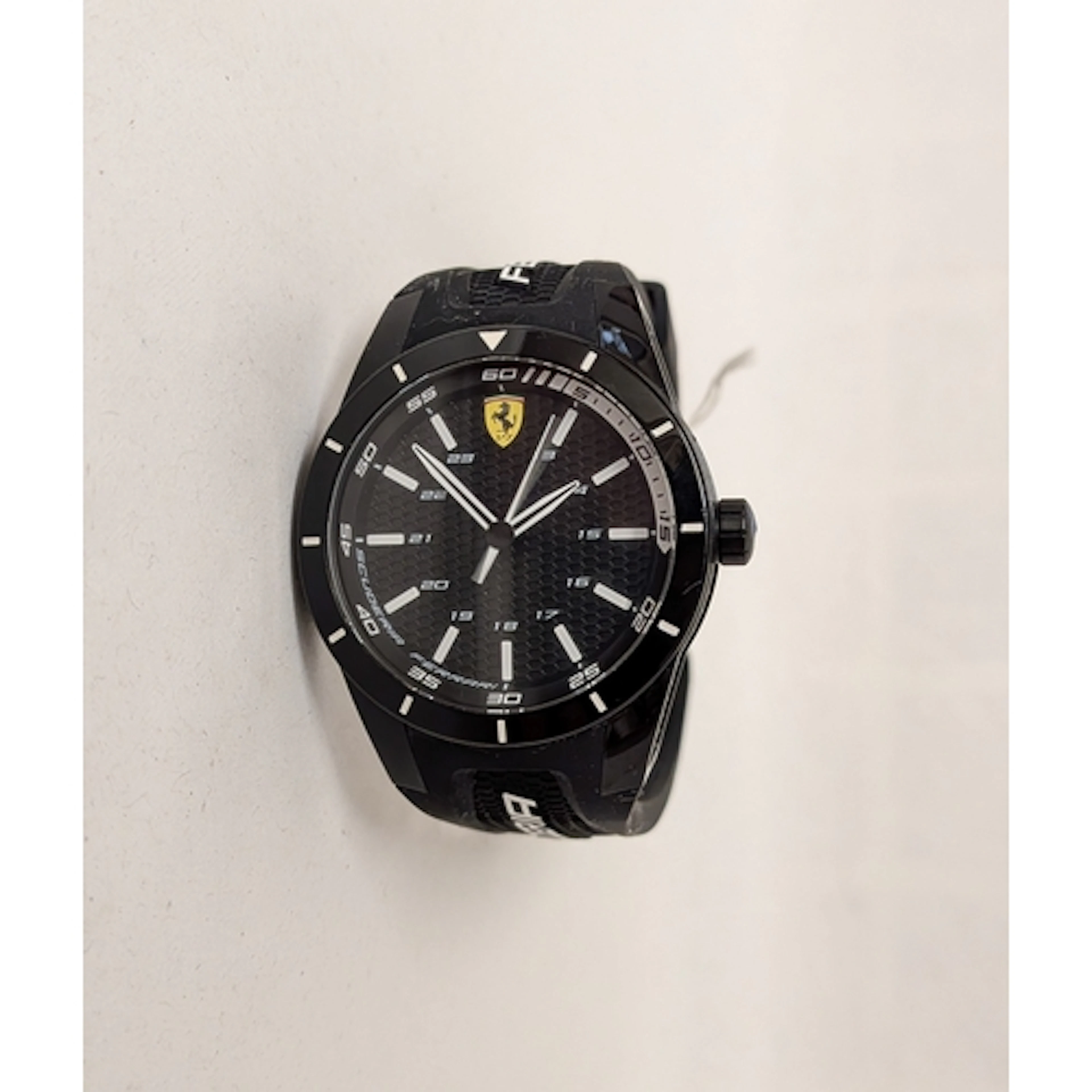 A modern gents Ferrari Scuderia quartz wristwatch on a black...