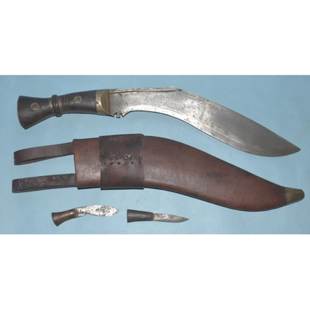A Nepalese kukri knife in leather scabbard, with mismatched ...