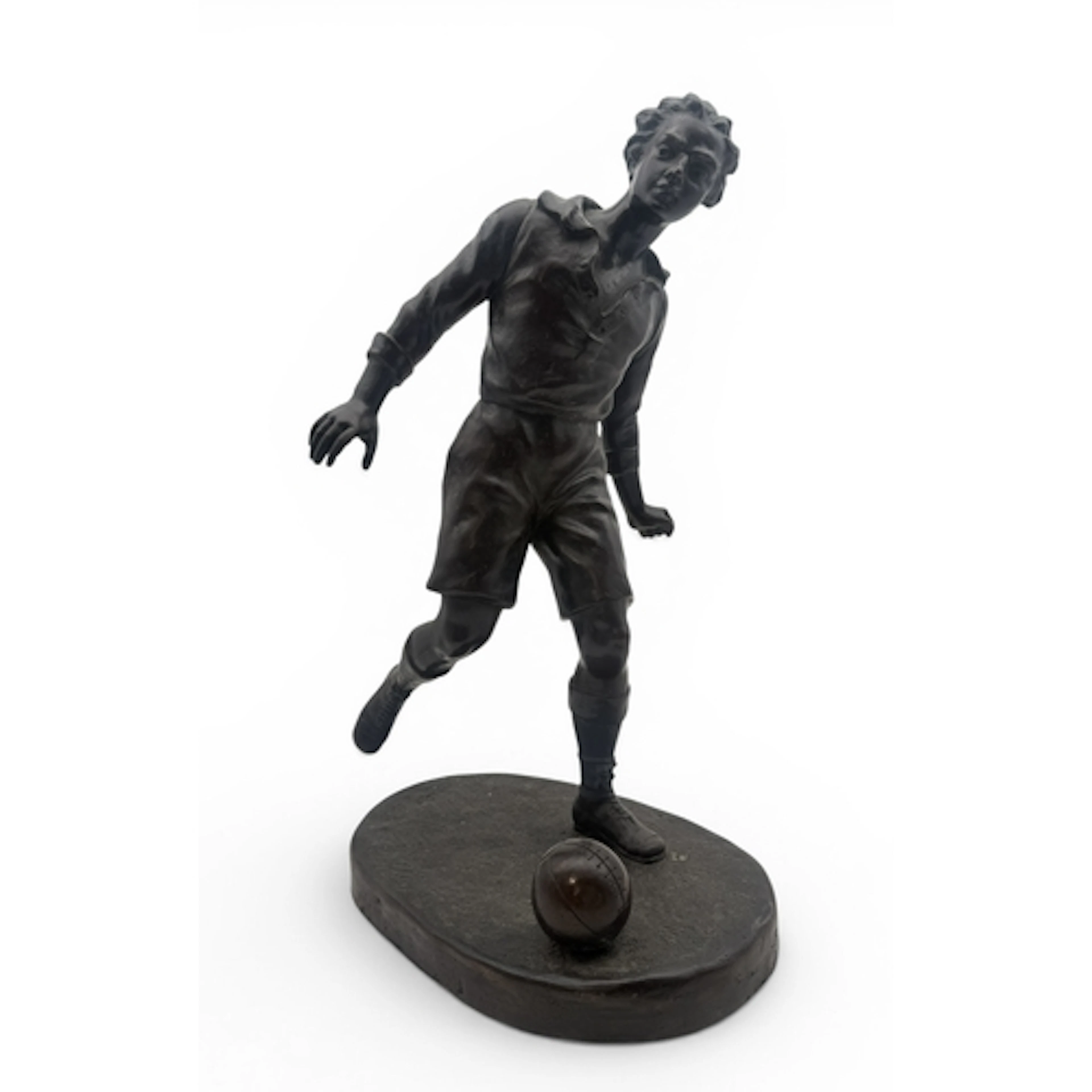 A BRONZED SCULPTURE OF A FOOTBALLER 47cm H