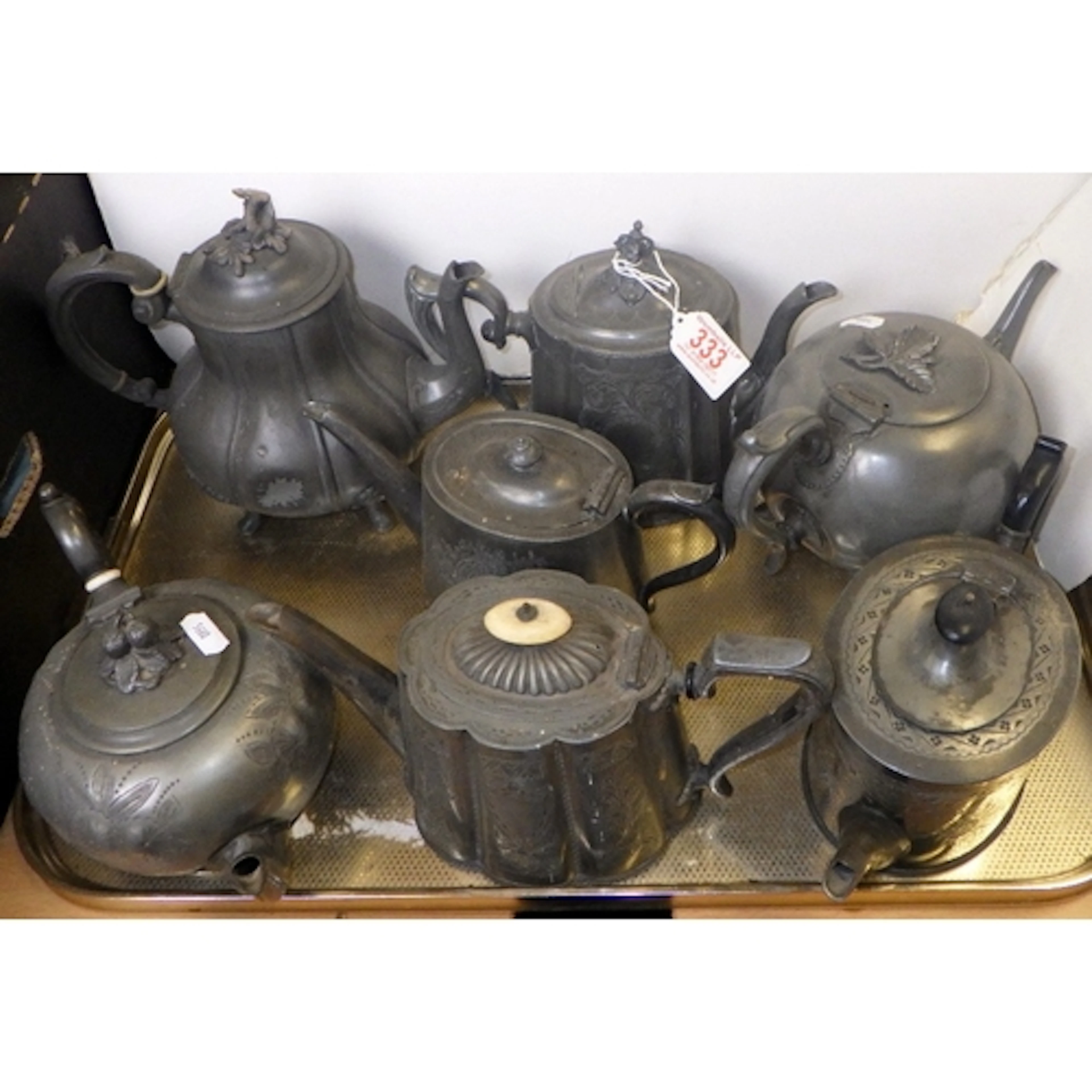 A group of seven pewter tea pots