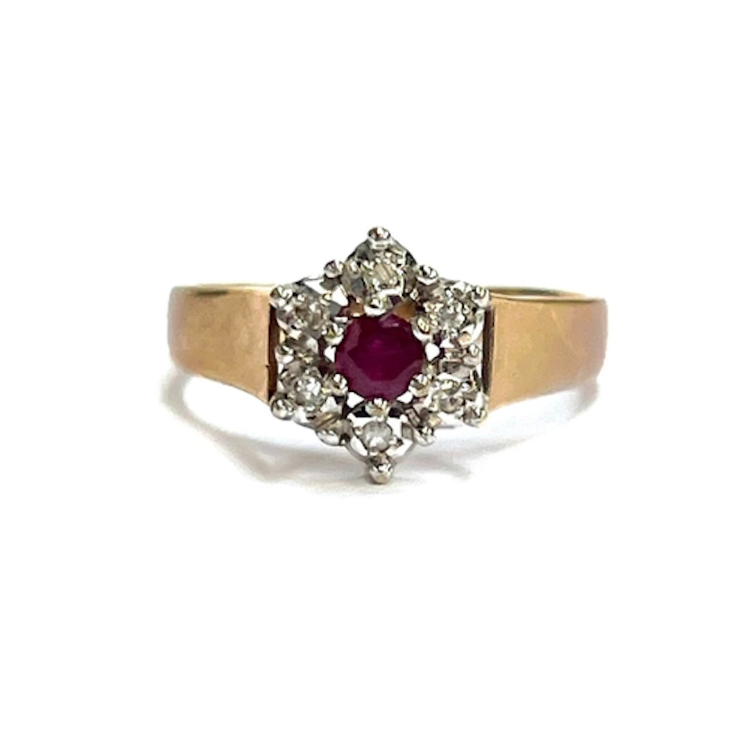 A vintage 9ct gold, diamond and ruby cluster ring, the centr...