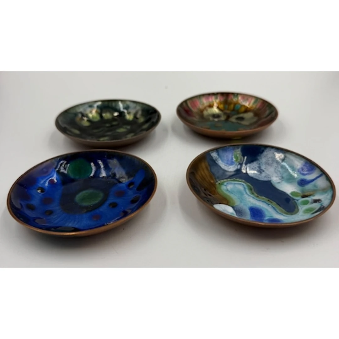 Four decorative Norwegian enamel on copper dishes stamped on...