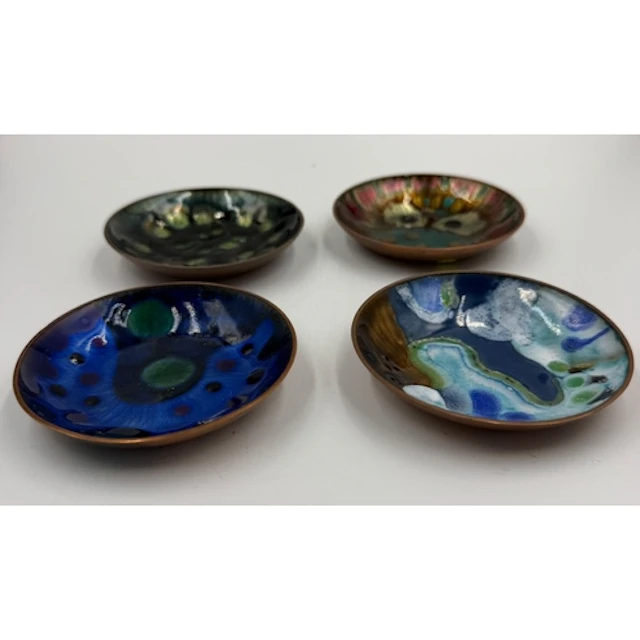 Four decorative Norwegian enamel on copper dishes stamped on...