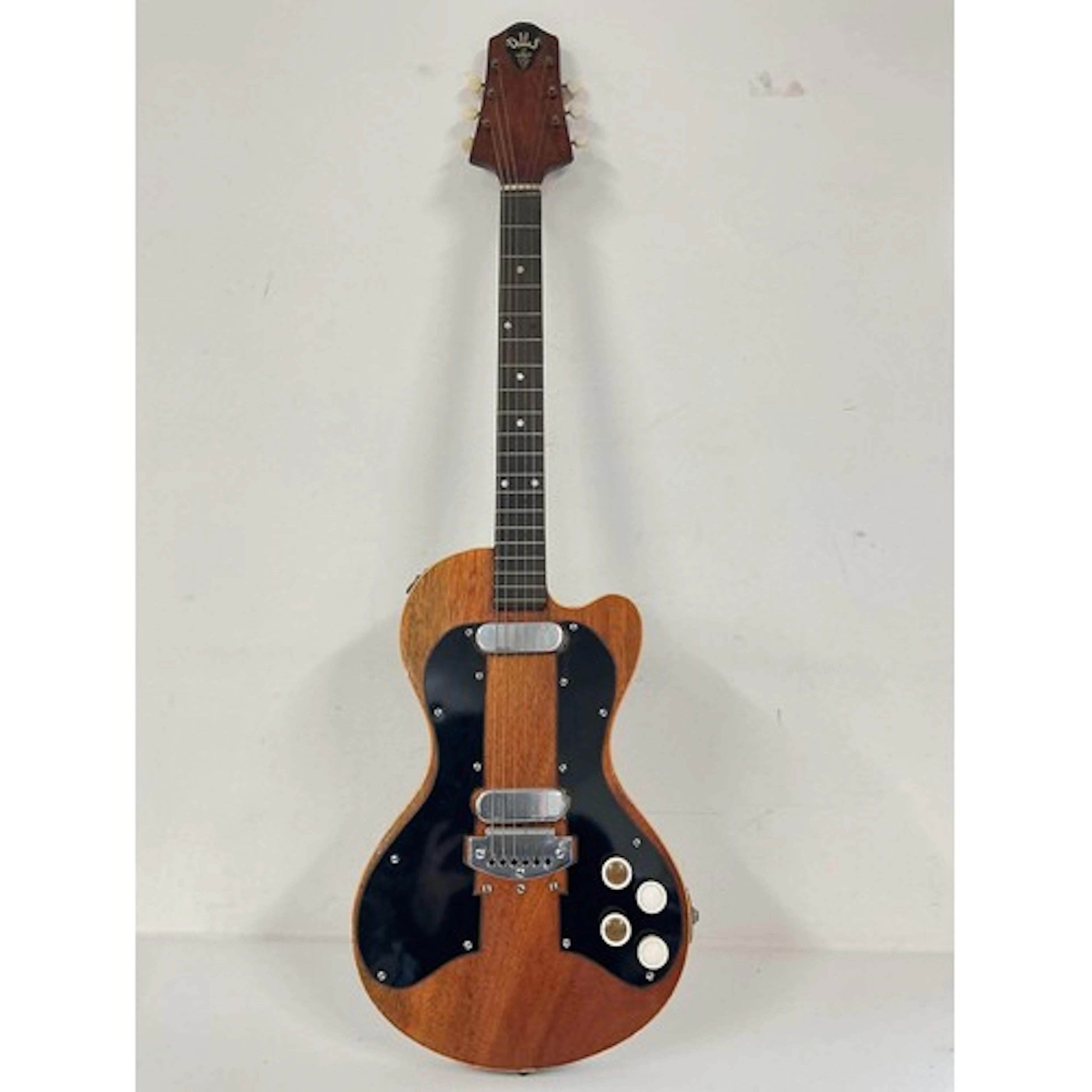 A Dallas Tuxedo double pickup model electric guitar. No case...