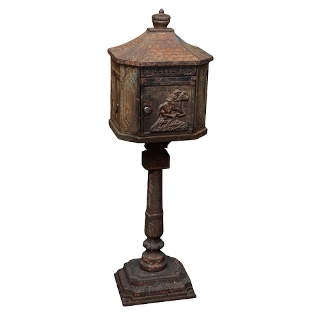 A cast iron post box, early 20th century; modelled as a pavi...