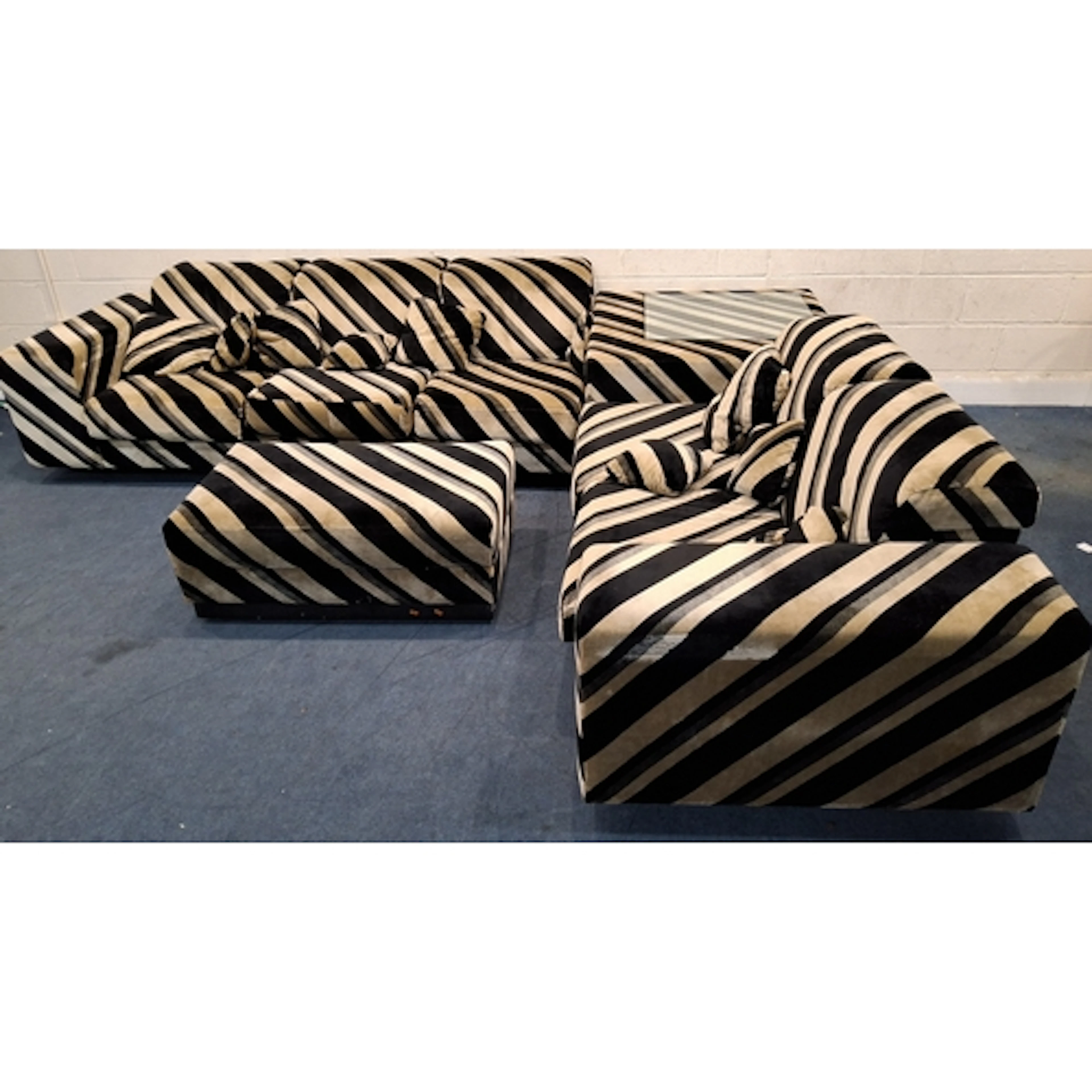 HOWARD KEITH, A LARGE MODULAR CORNER SUITE, comprising a thr...