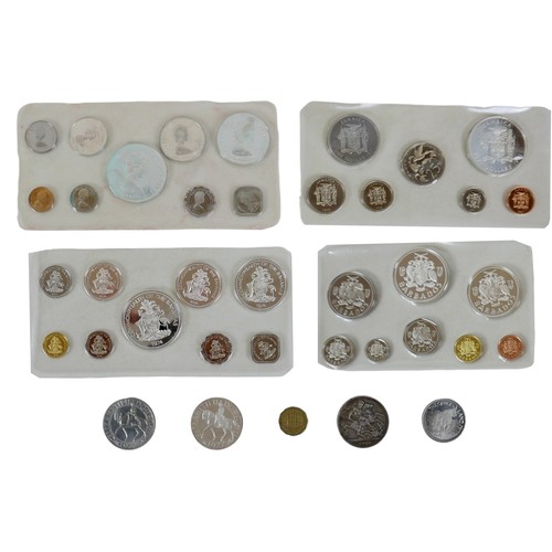 A group of coin sets, comprising 'Commonwealth of the Bahama...