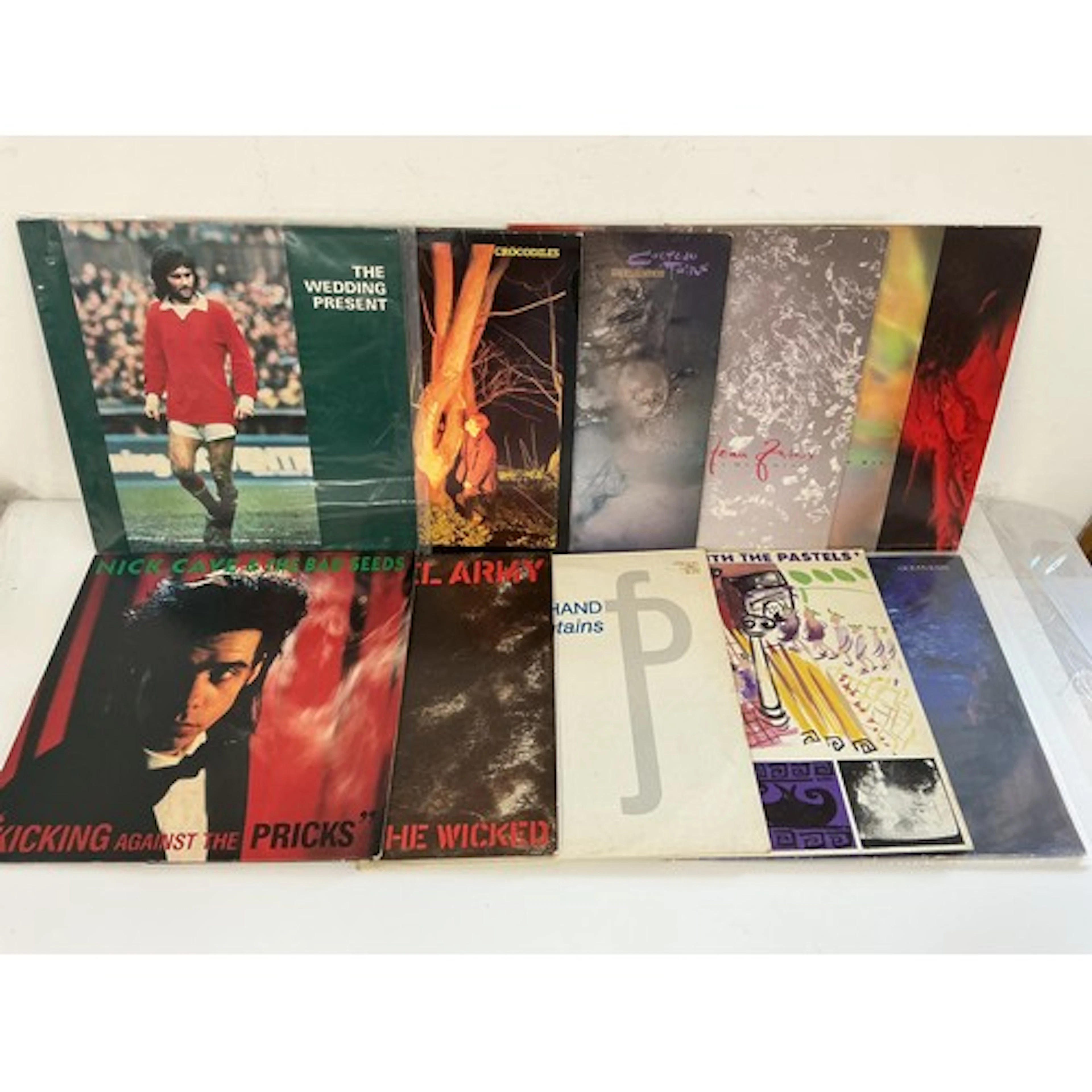 Two bags containing 21 LPs and 12” singles by various artist...