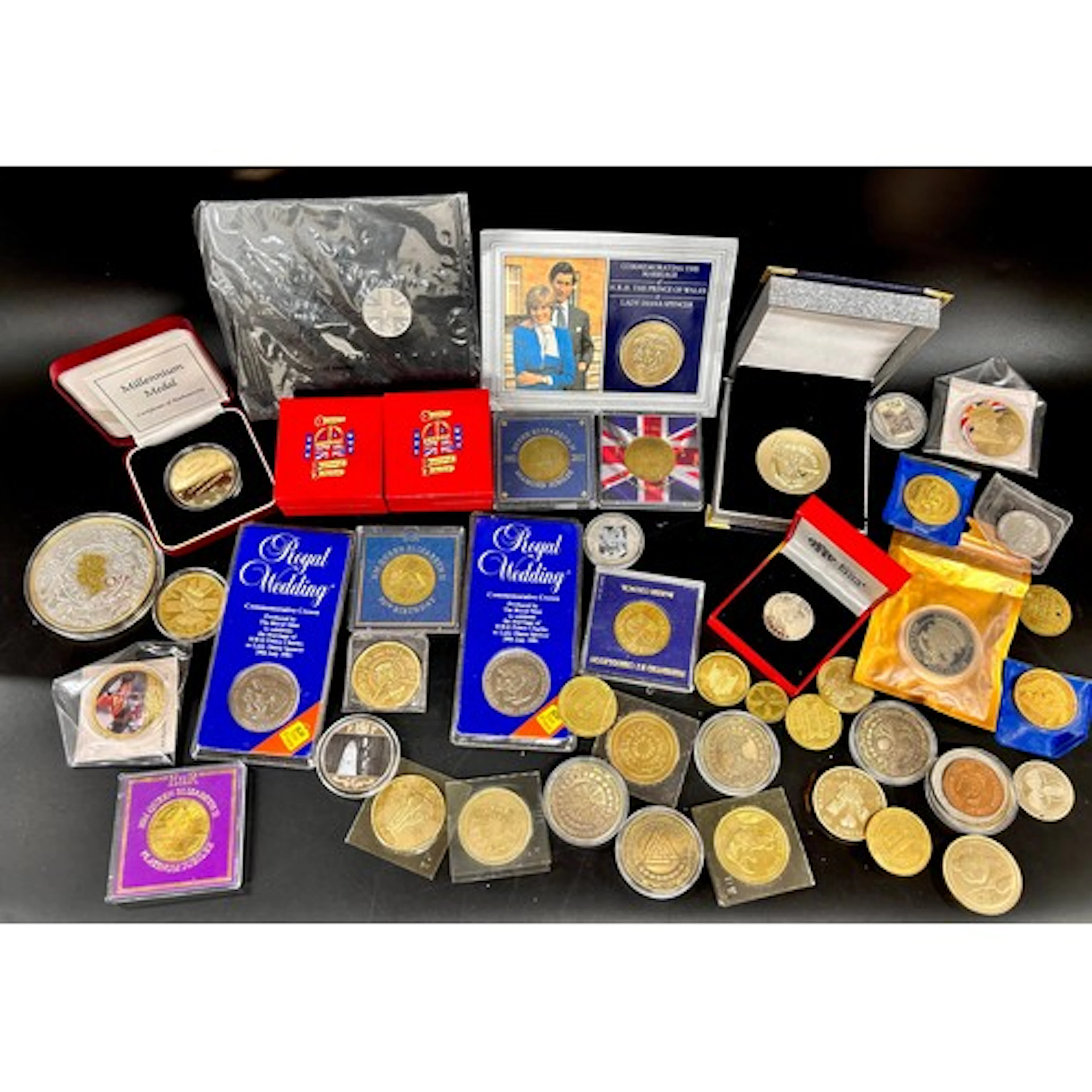 A collection of Royalty commemorative coins, etc.