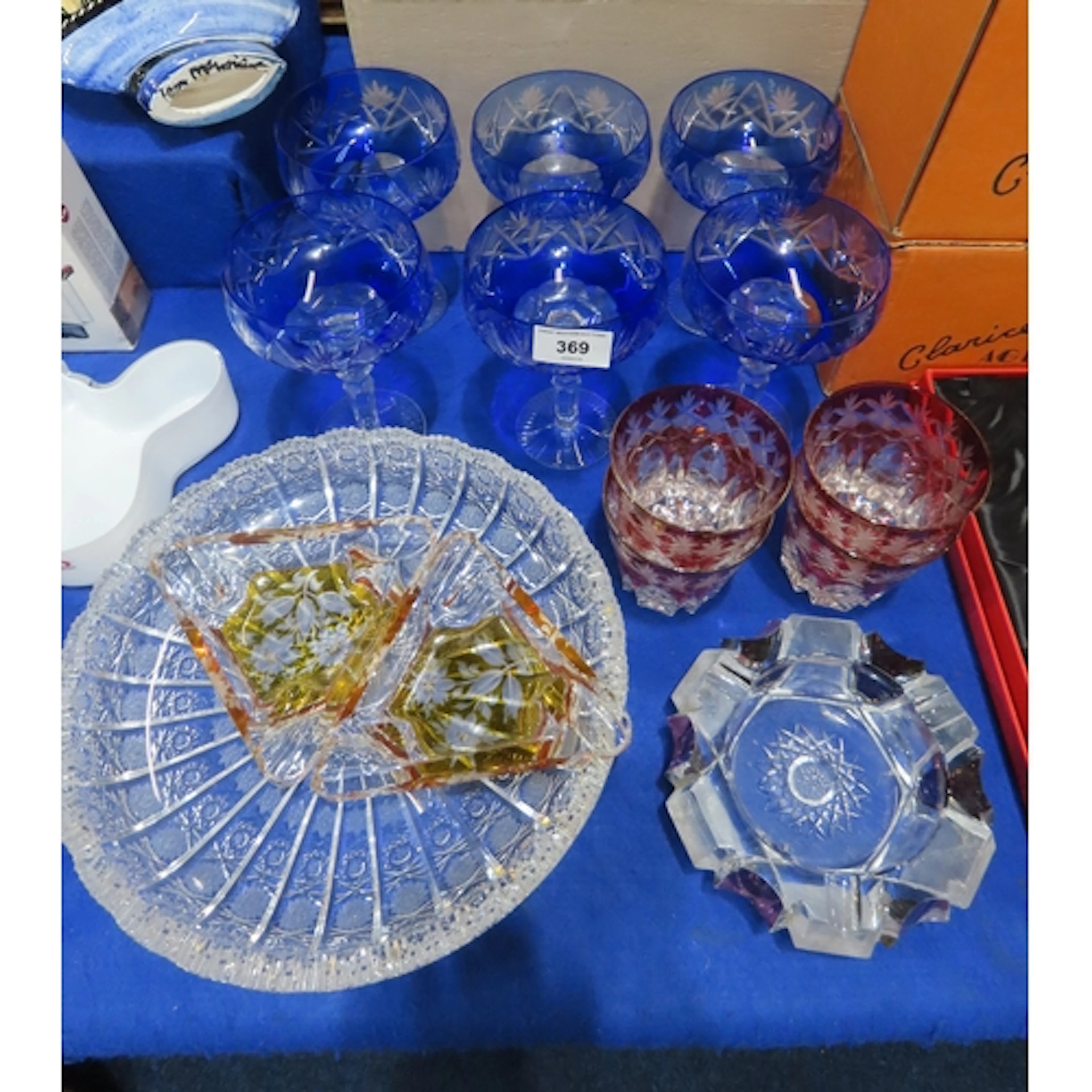 Six Bohemian blue flashed and cut champagne coupes, four red...