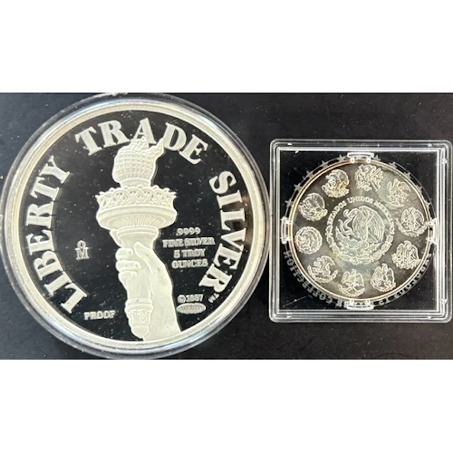 A pair of Mexican fine silver issues, comprising a five-ounc...