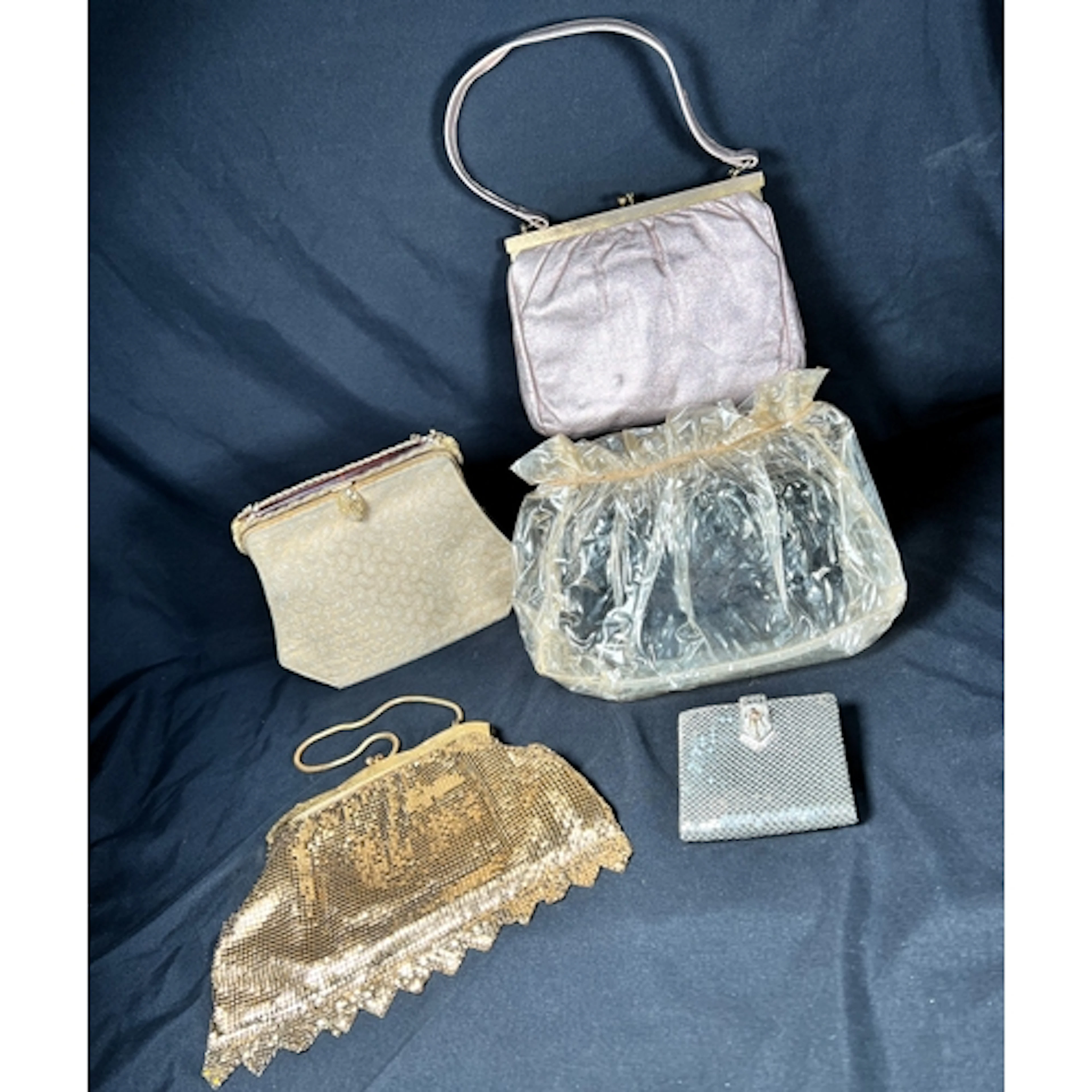 A mid 20th century metallic rose gold leather handbag by Bon...