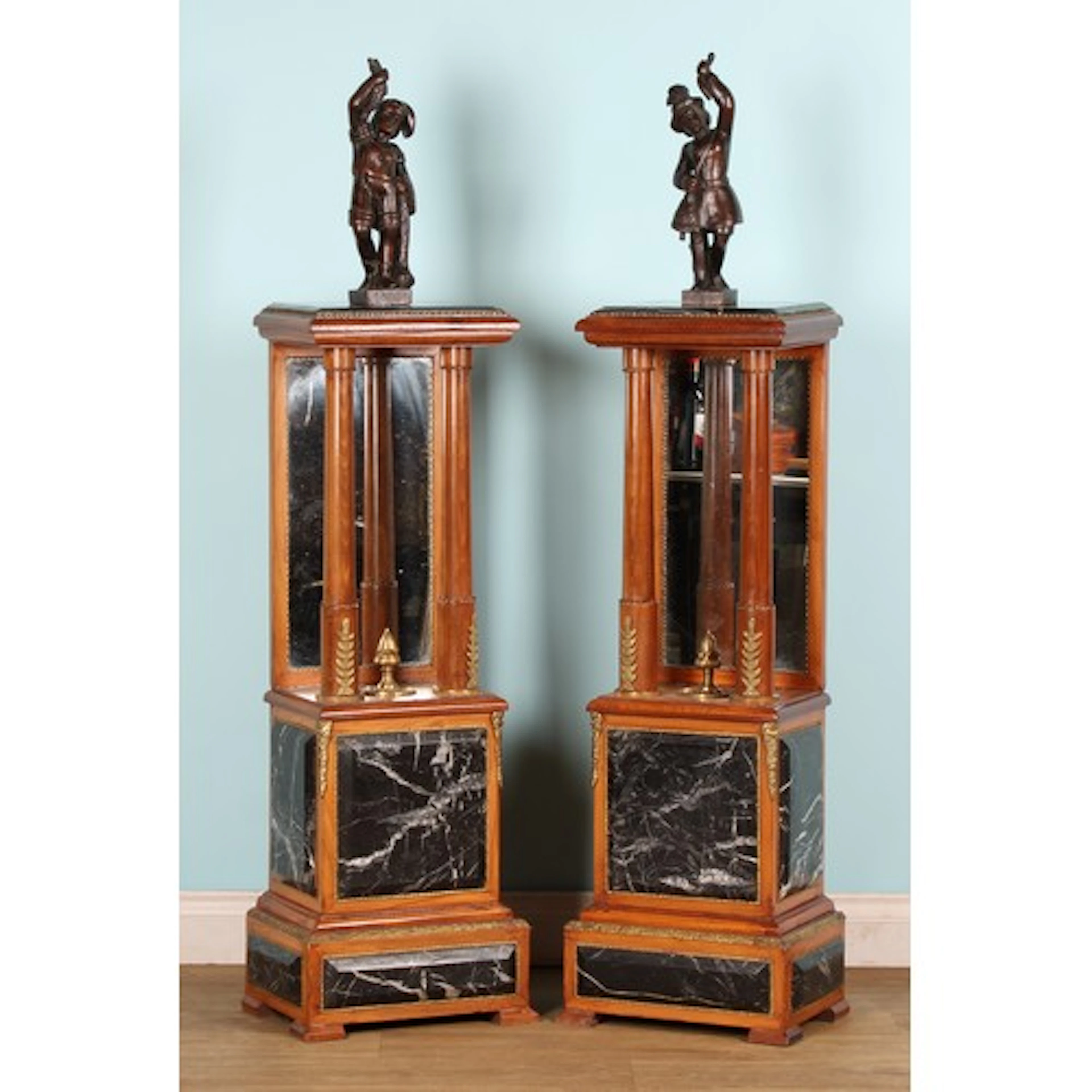A pair of French Empire style gilt metal and marble mounted ...