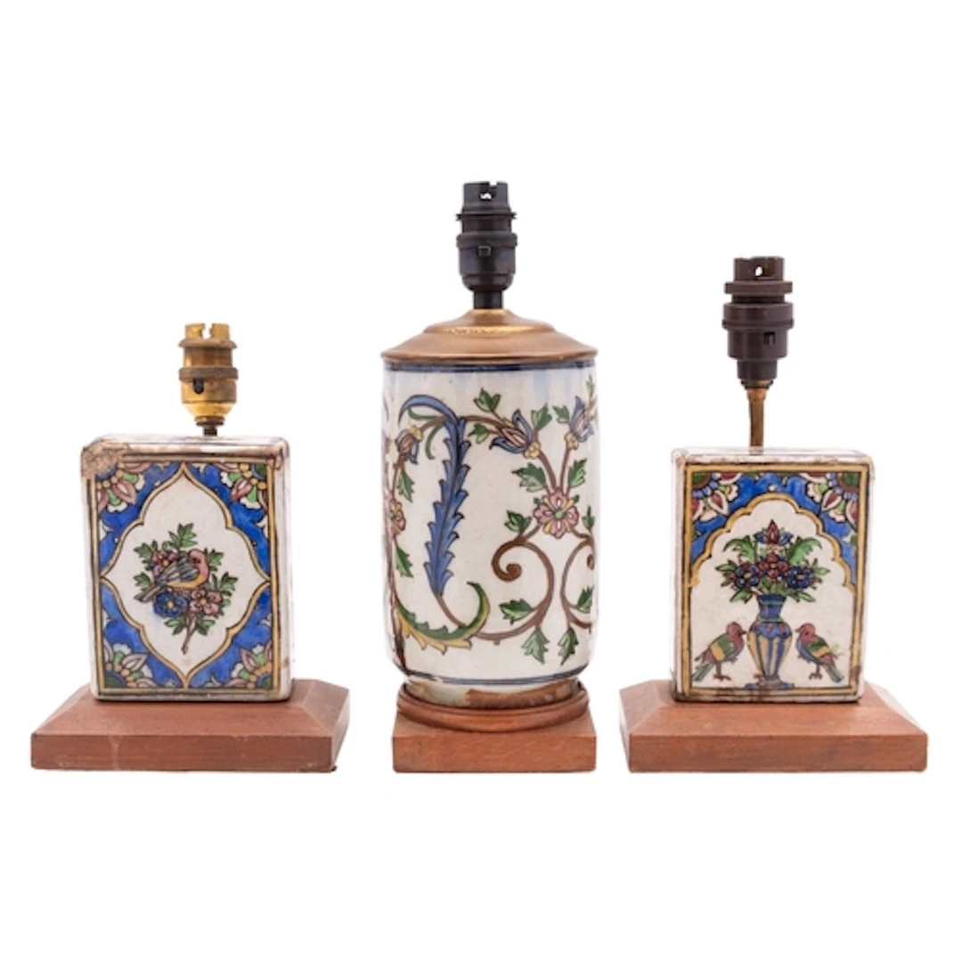Three pieces of Qajar pottery mounted as lamps, comprising t...