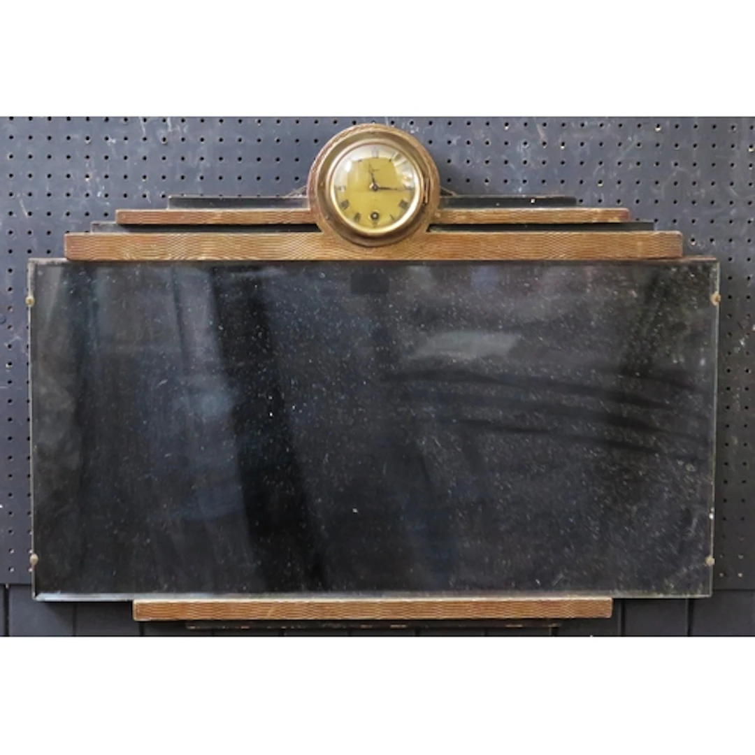 An Art Deco period wall mirror, the bevelled mirror plate su...