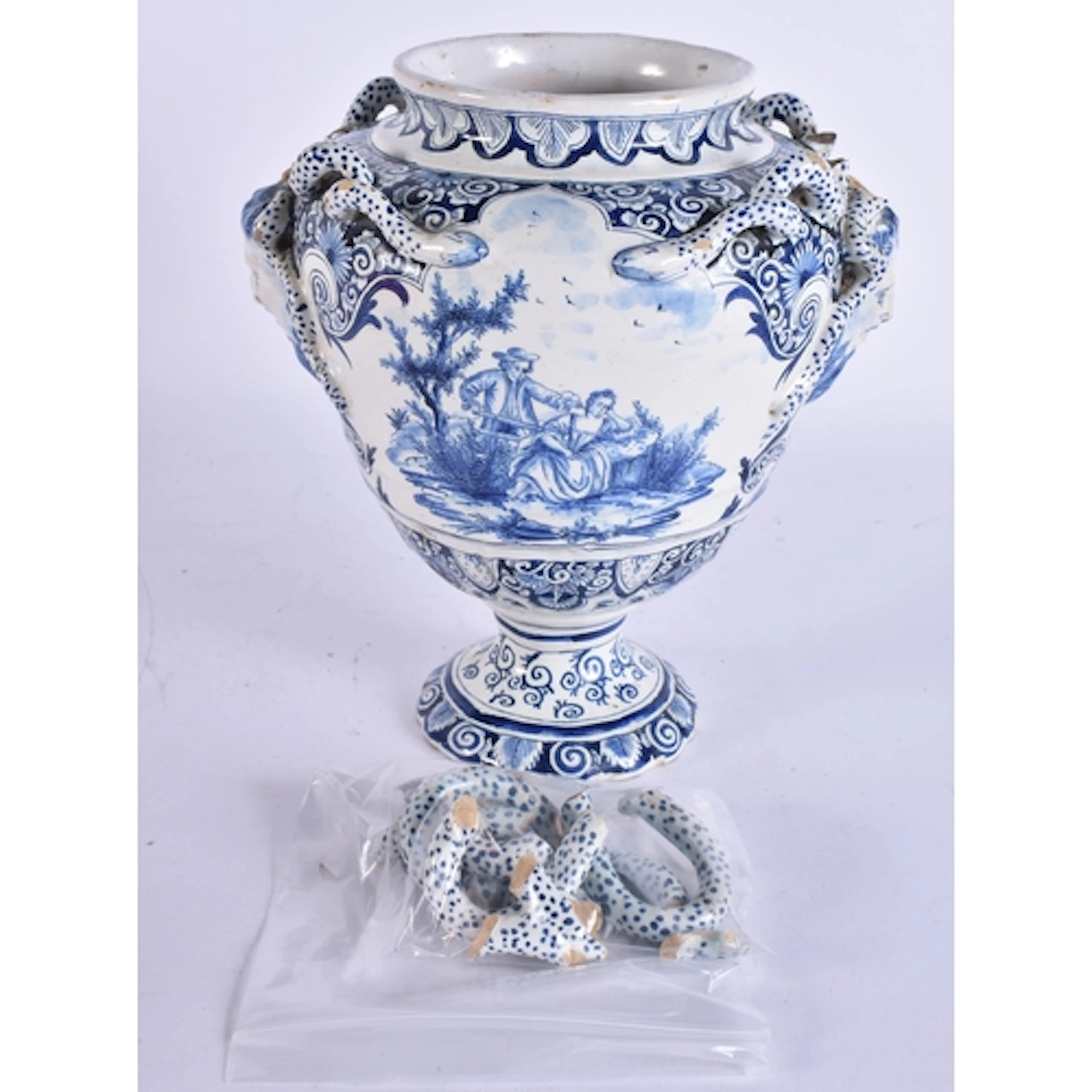 AN 18TH CENTURY DUTCH DELFT TIN GLAZED BLUE AND WHITE VASE p...