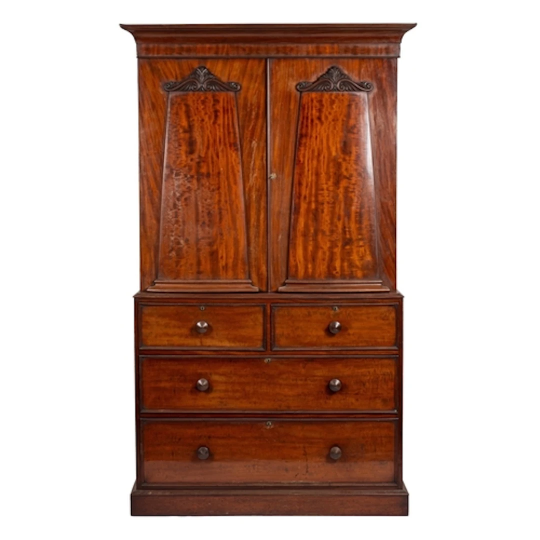 A Regency mahogany linen press, early 19th century; with ovo...