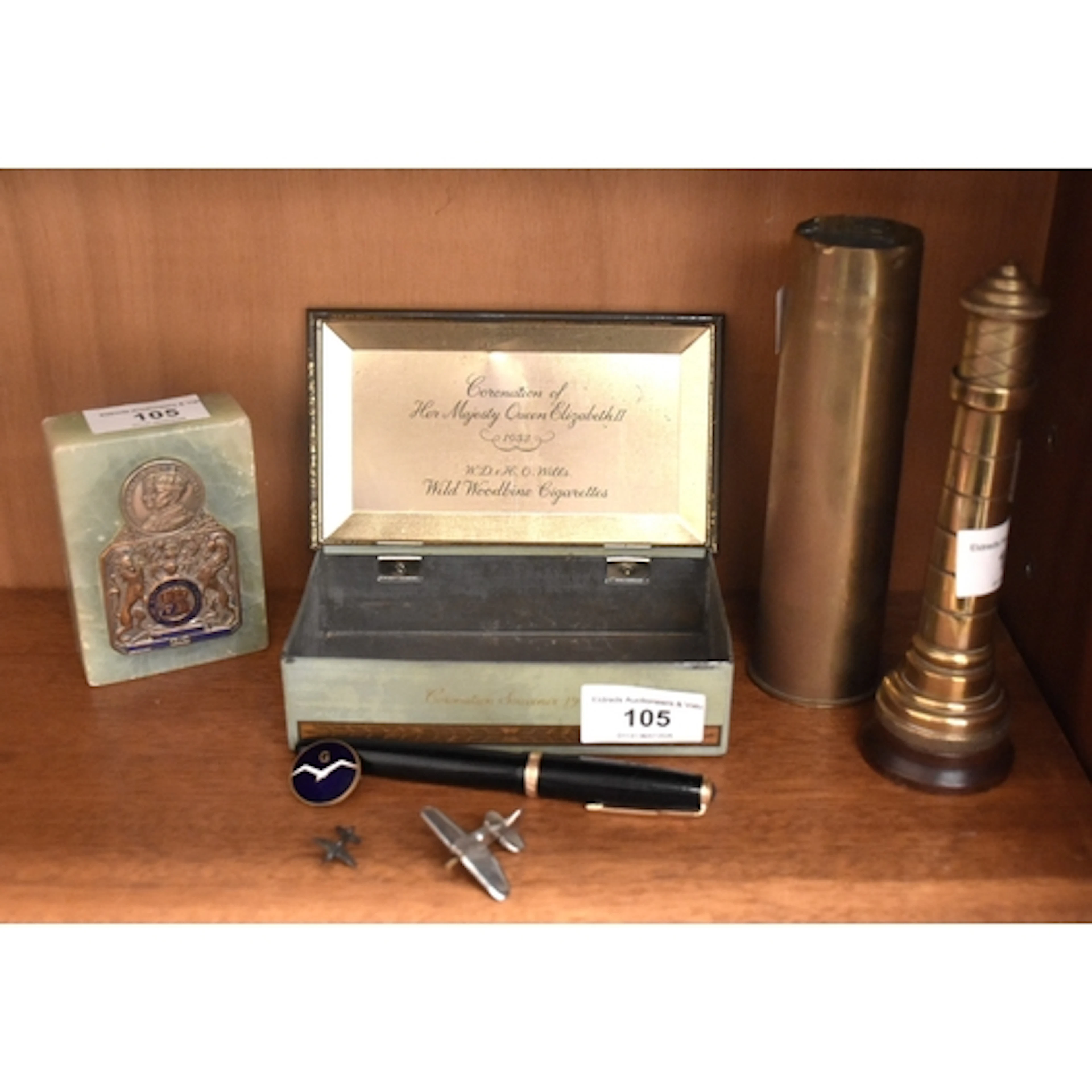 A trench art brass lighter in the form of a lighthouse, on w...