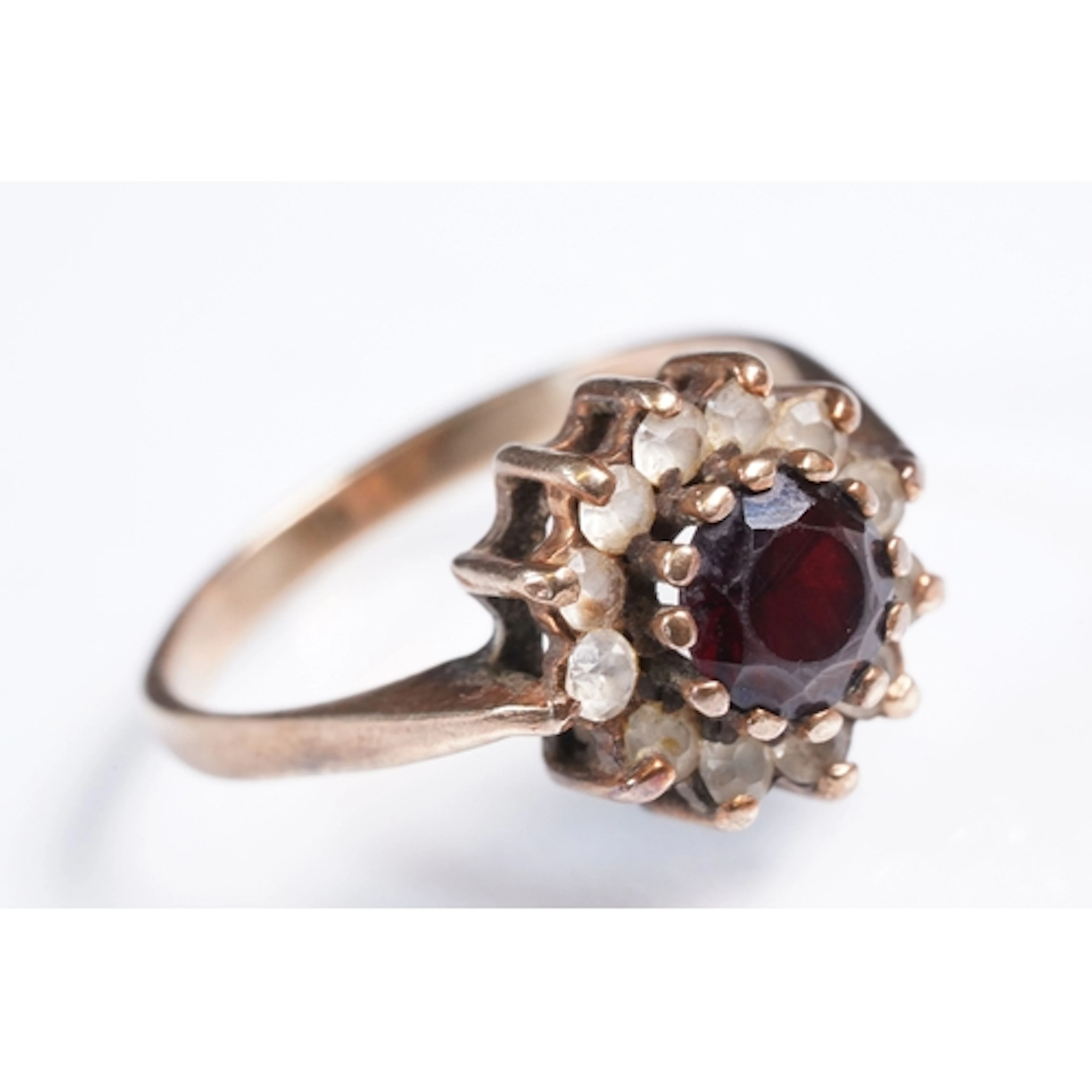 9ct gold, red and white stone cluster ring. The ring being s...