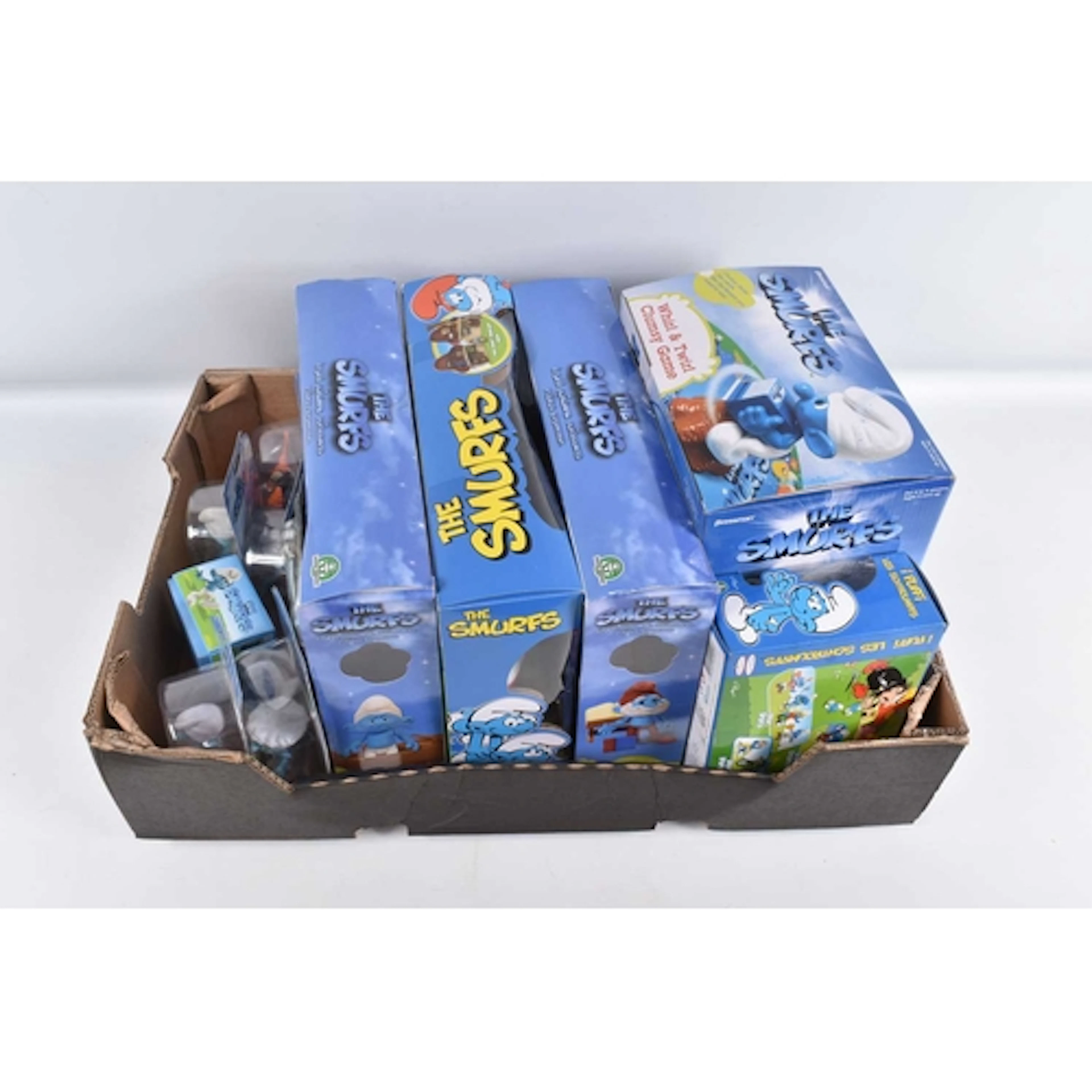 A BOXED COLLECTION OF THIRTEEN PEYO SMURFS ITEMS, to include...