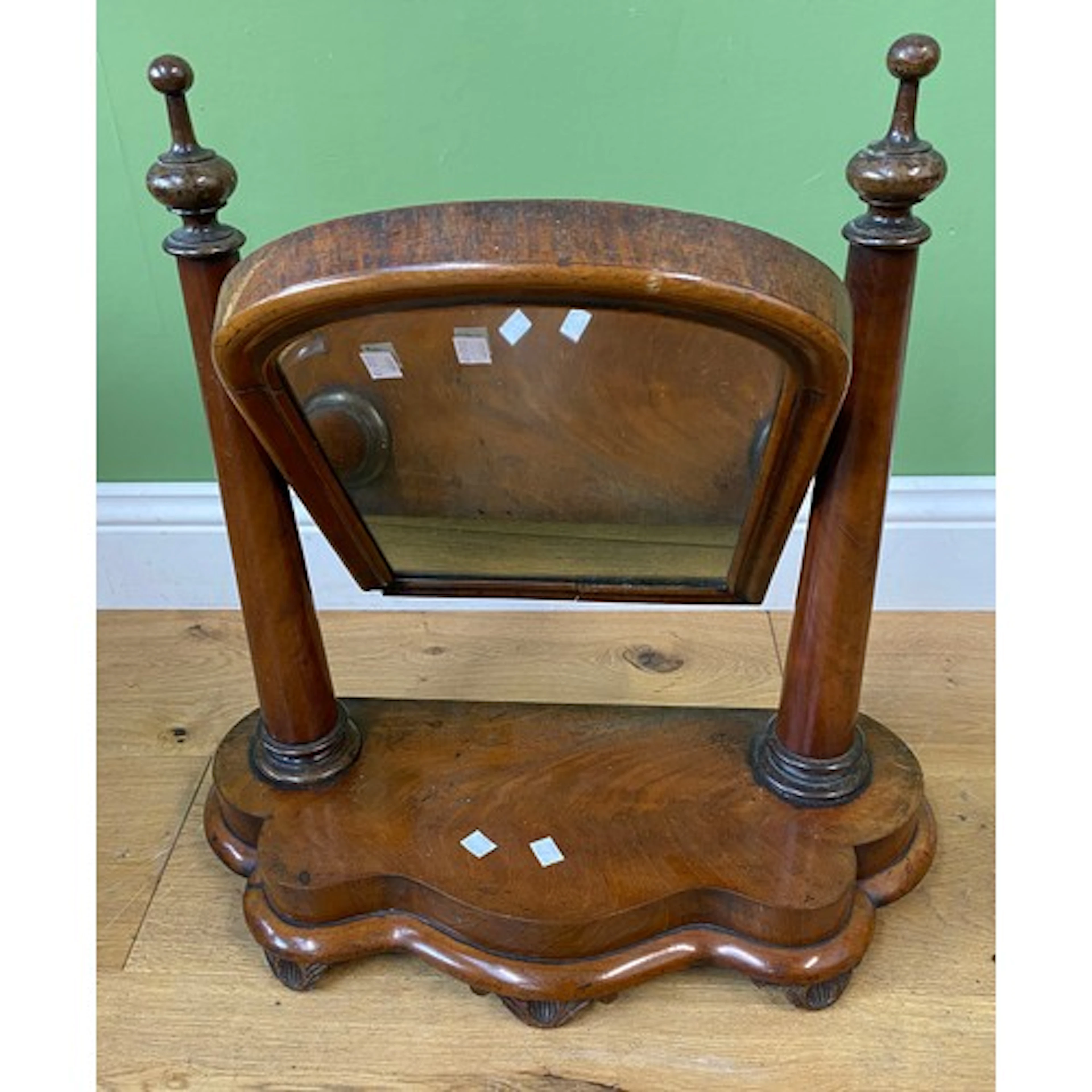 A Victorian mahogany toilet mirror on serpentine base, 59cmW