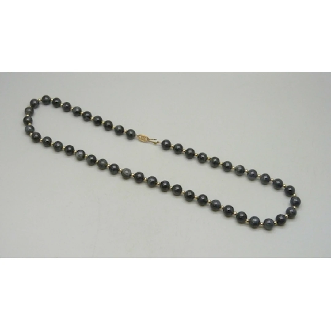 A 14ct gold mounted gemstone necklace with gold spacers, 46g...