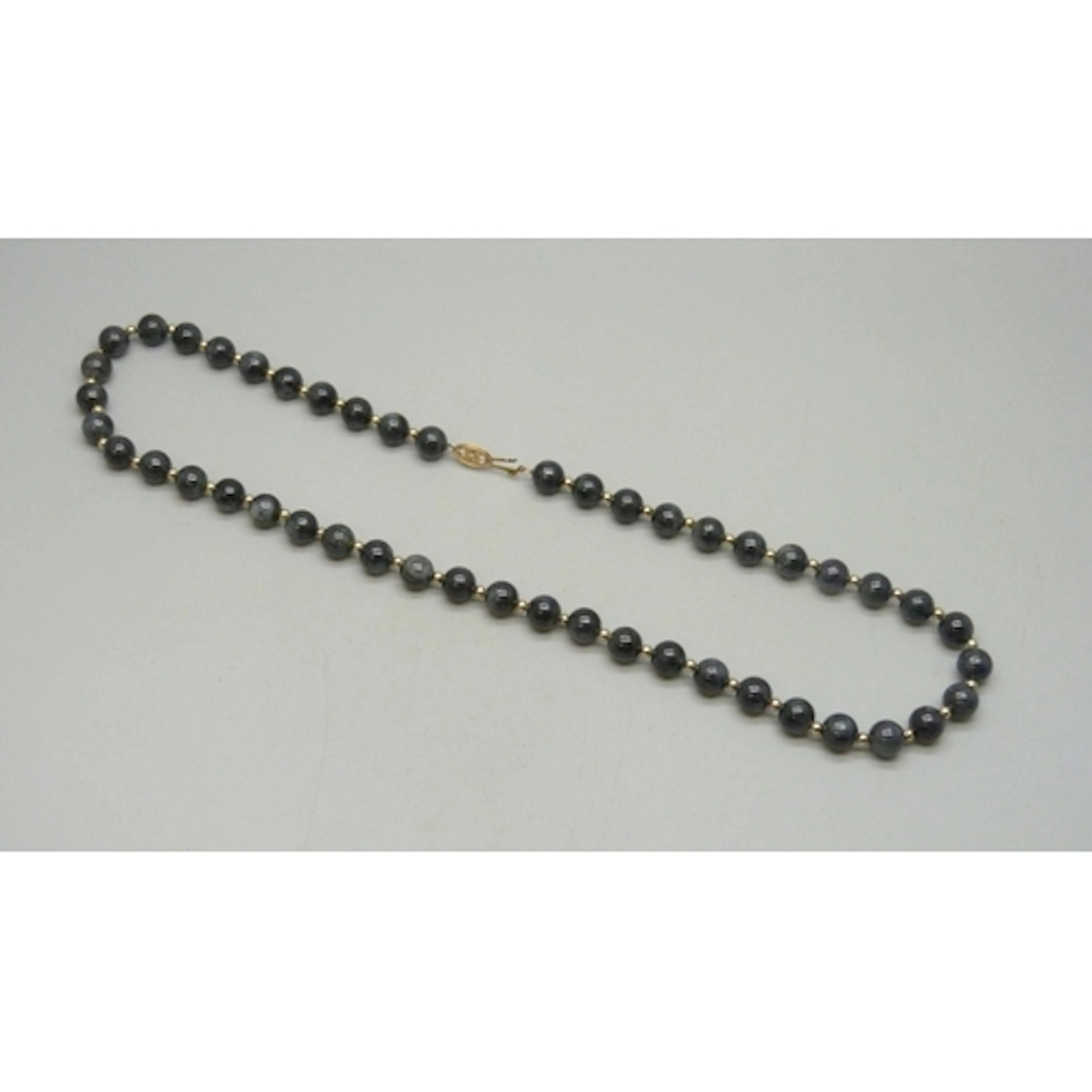 A 14ct gold mounted gemstone necklace with gold spacers, 46g...