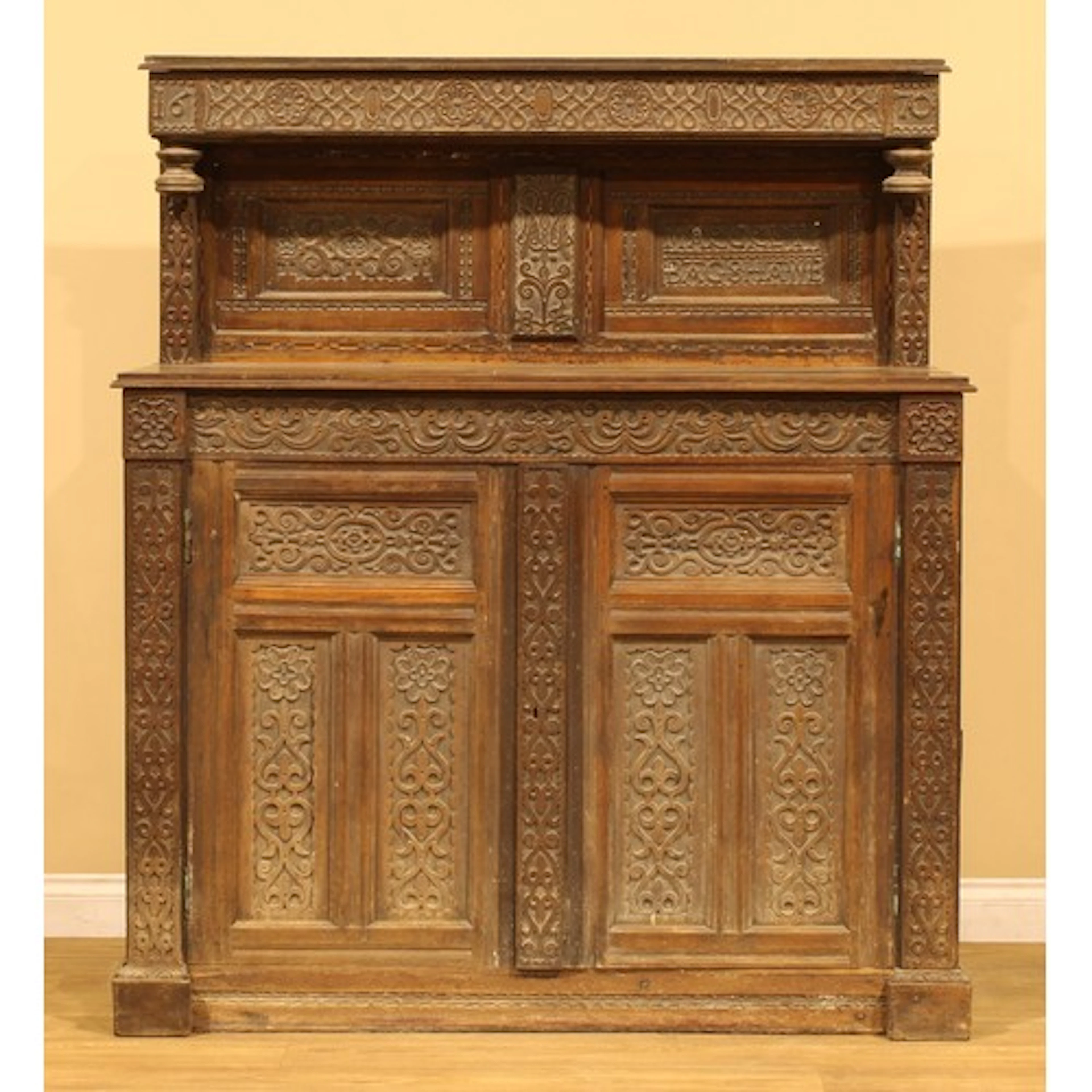 An Arts & Crafts period oak cupboard, in the 17th century ta...