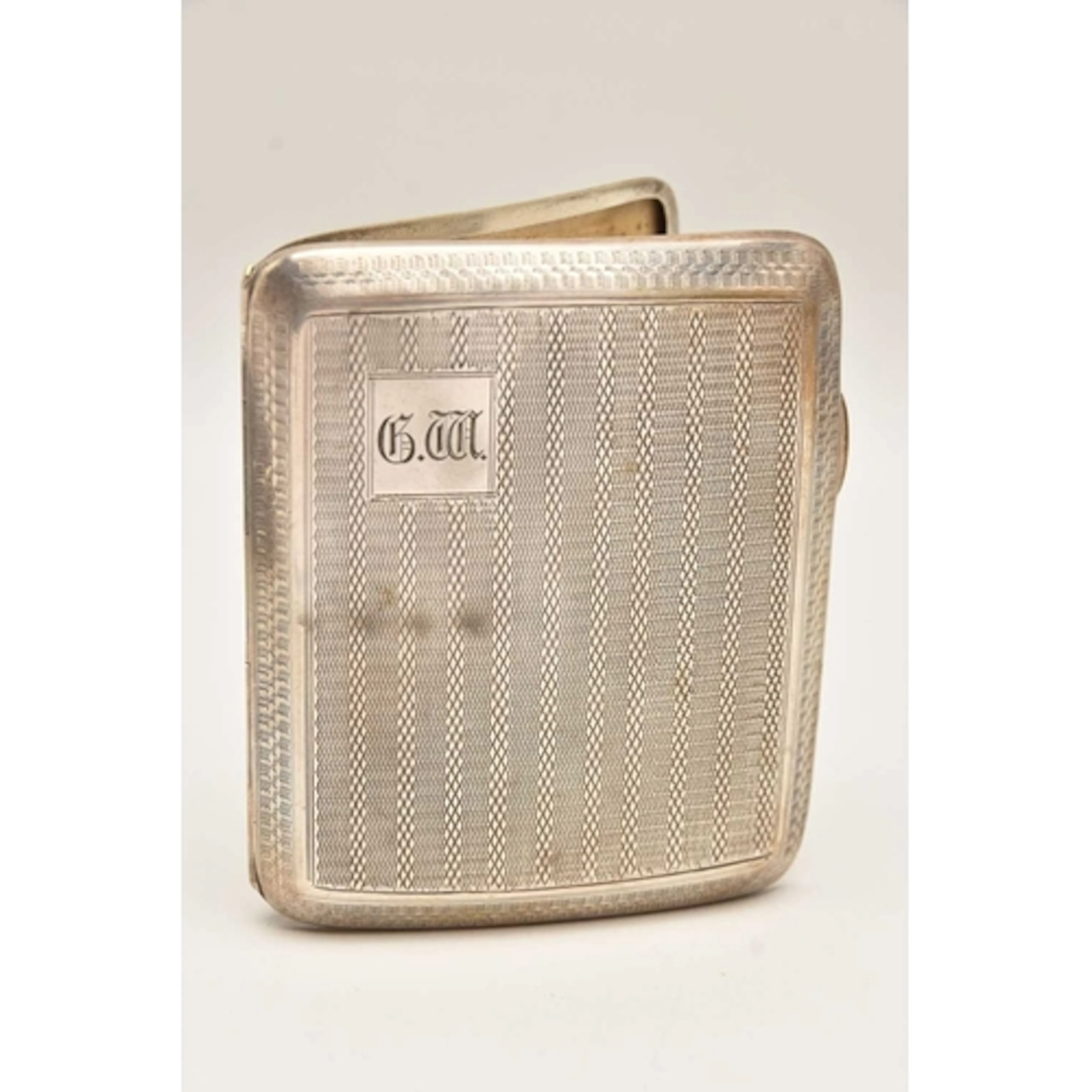 AN EARLY 20TH CENTURY SILVER CIGARETTE CASE, rectangular for...