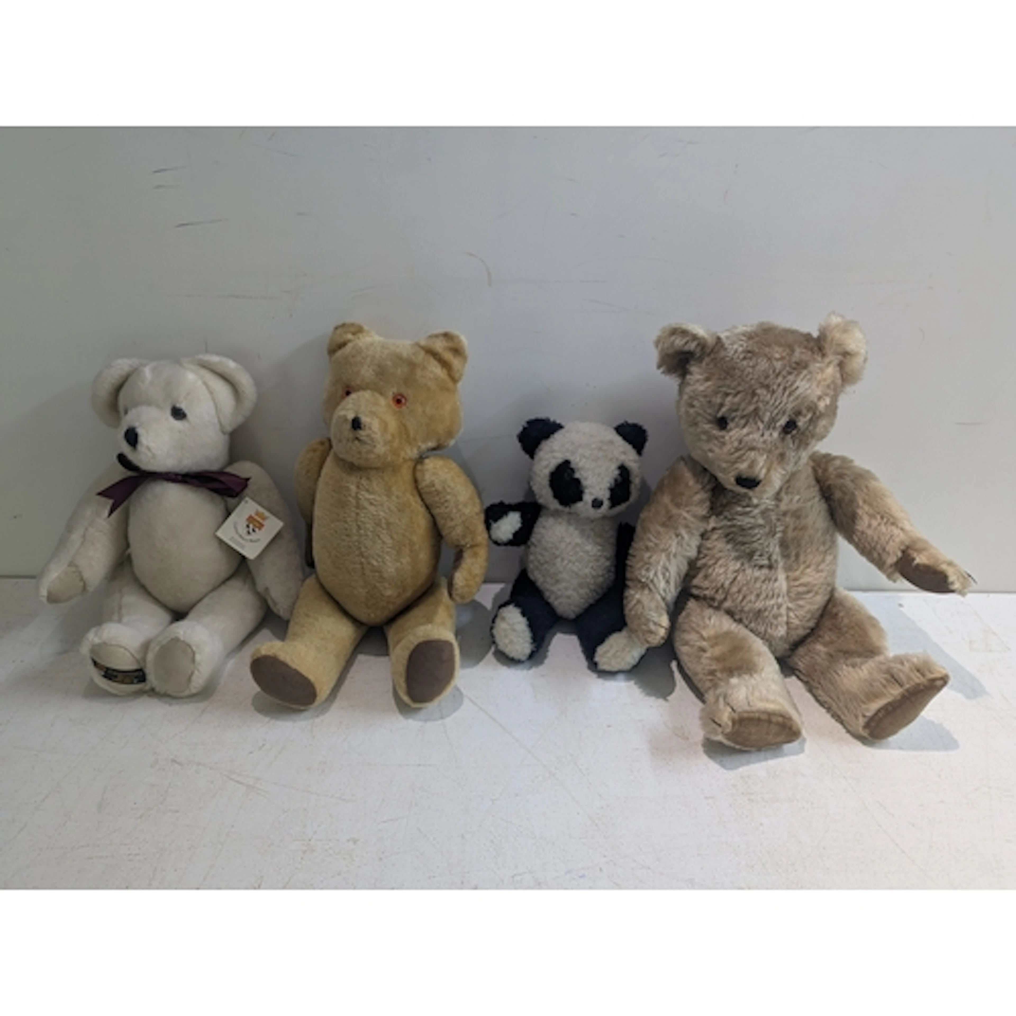 A collection of four mid/late 20th century teddy bears to in...