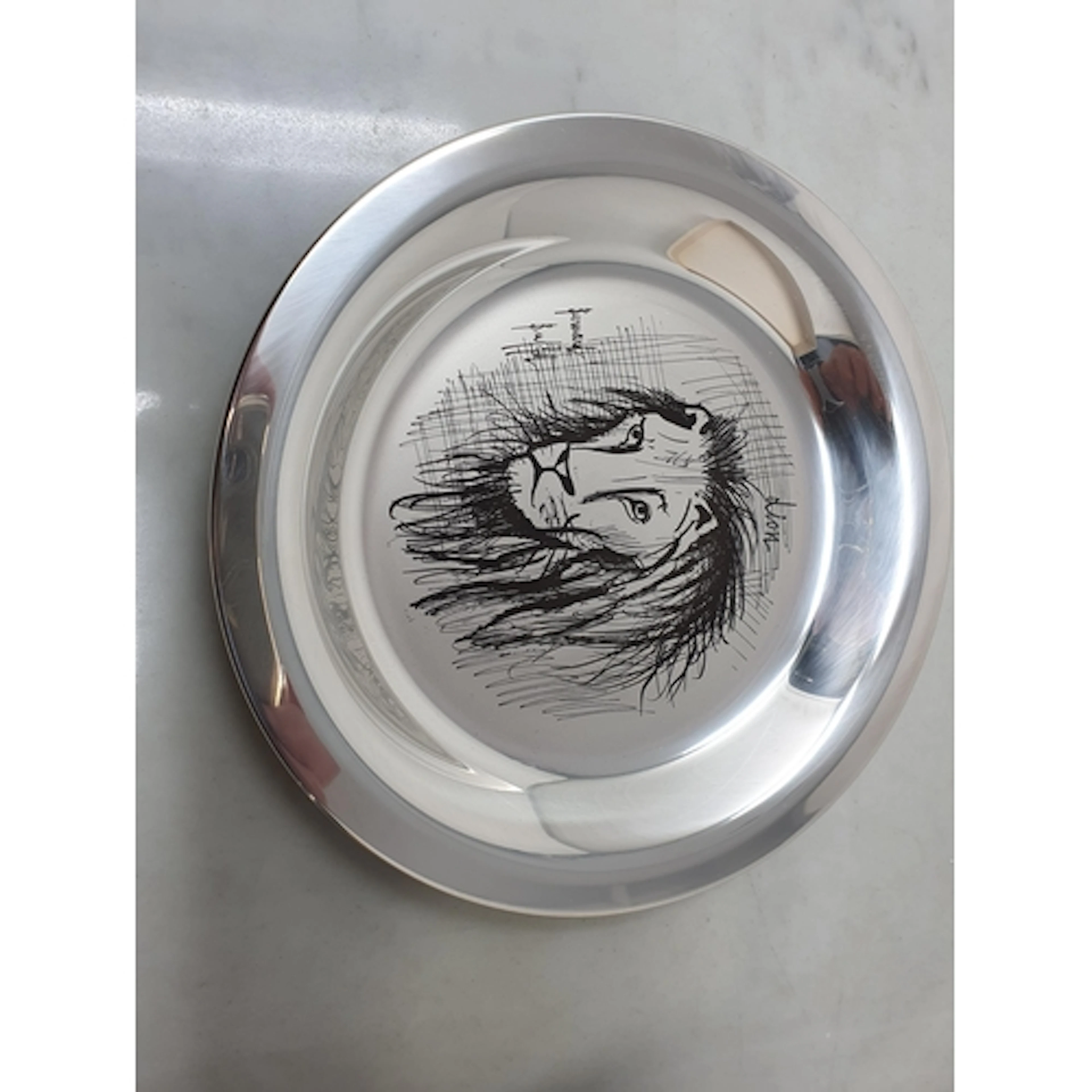 An Elizabeth II silver Lion Plate by Bernard Buffet, 195gms,...