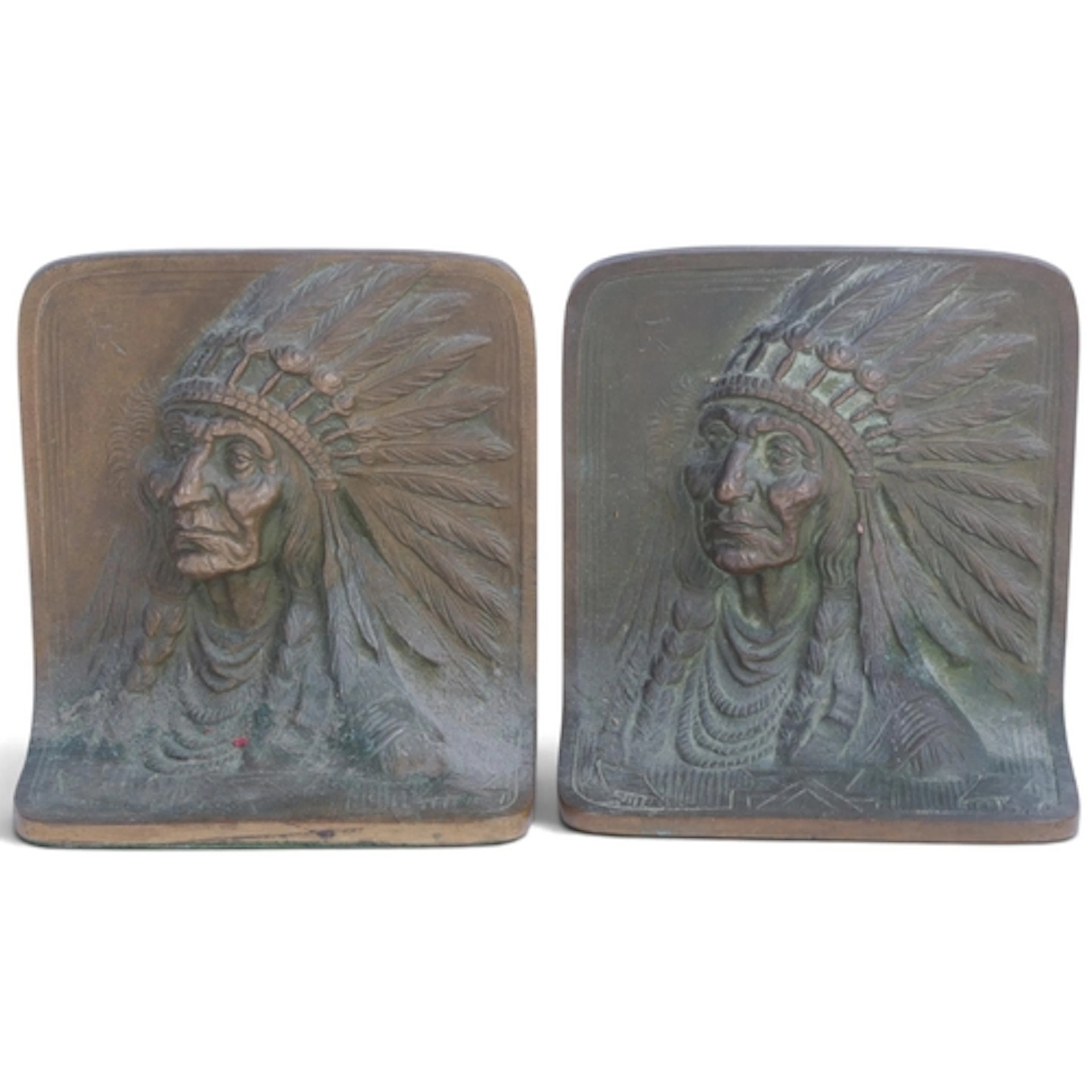 A pair of relief cast-bronze bookends, depicting Native Amer...