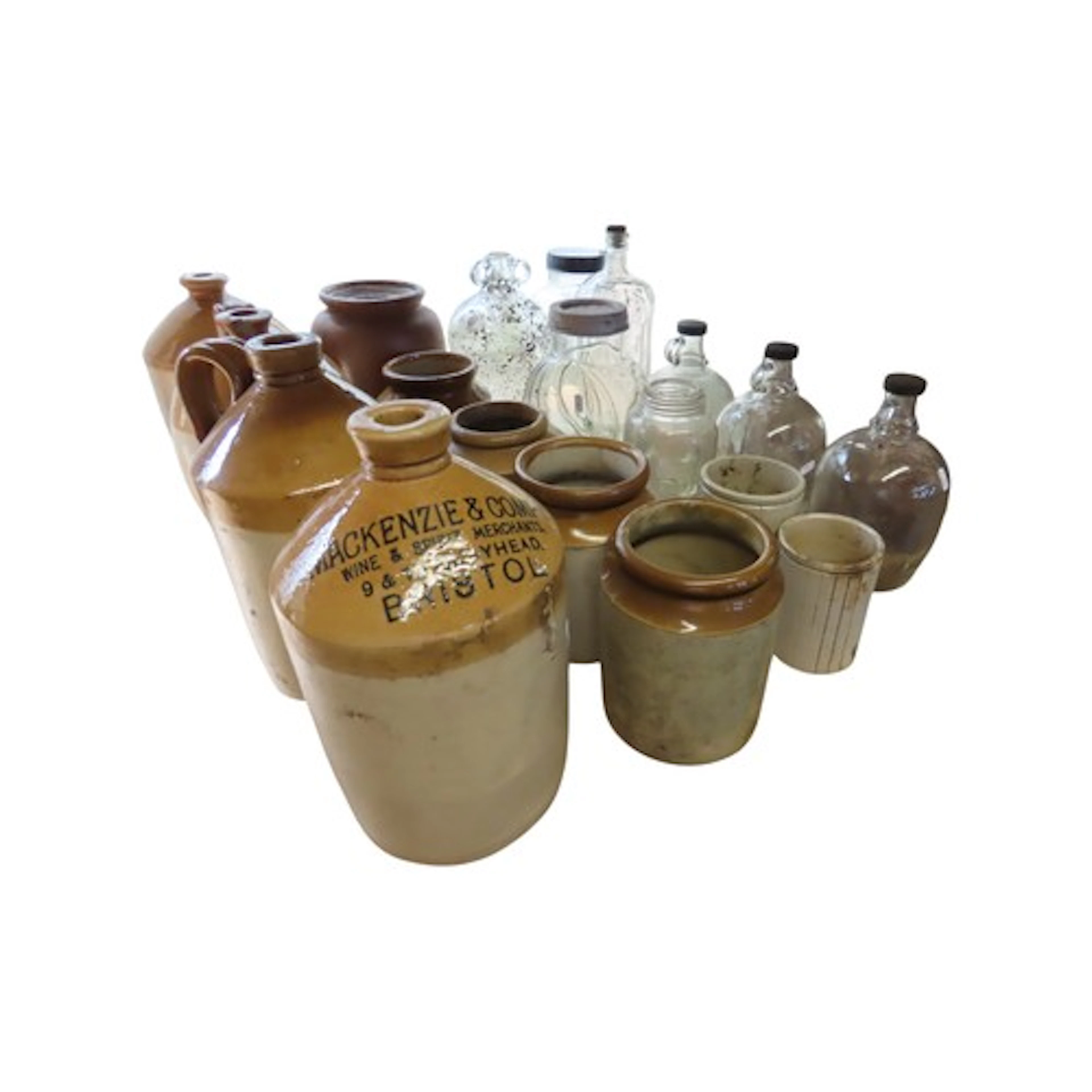 A small collection of stoneware flagons and jars, one with p...