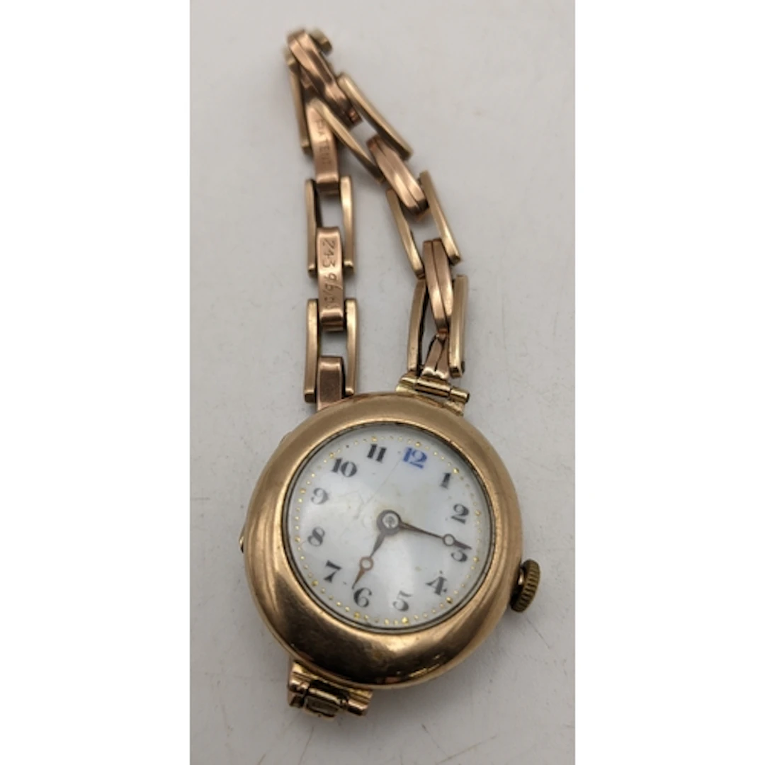 A 9ct gold cased ladies wrist watch on a 9ct gold Britannic ...