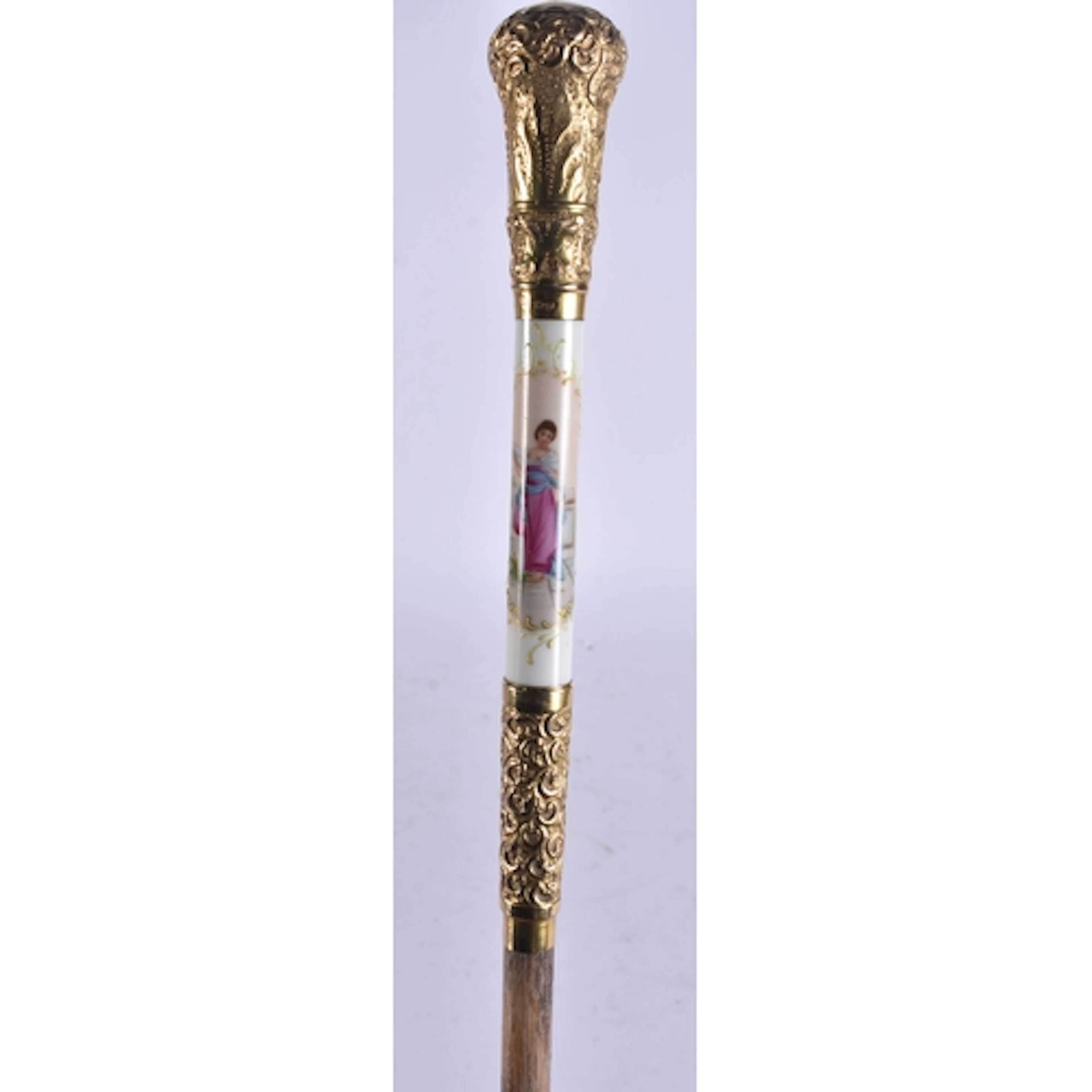 AN ANTIQUE GILT METAL AND PORCELAIN PARASOL. 86 cm long.