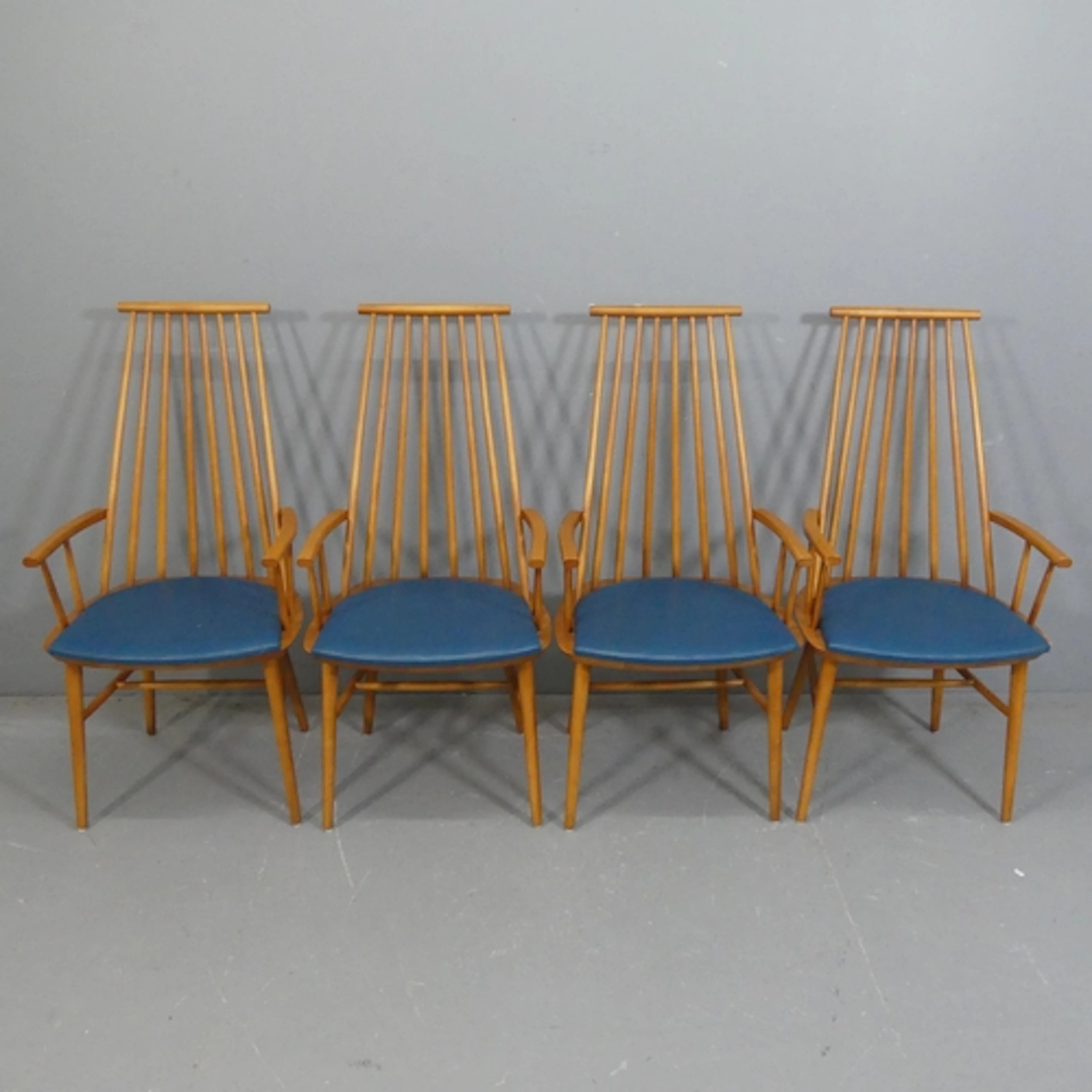 A set of four Danish mid-century design spindle back chairs ...