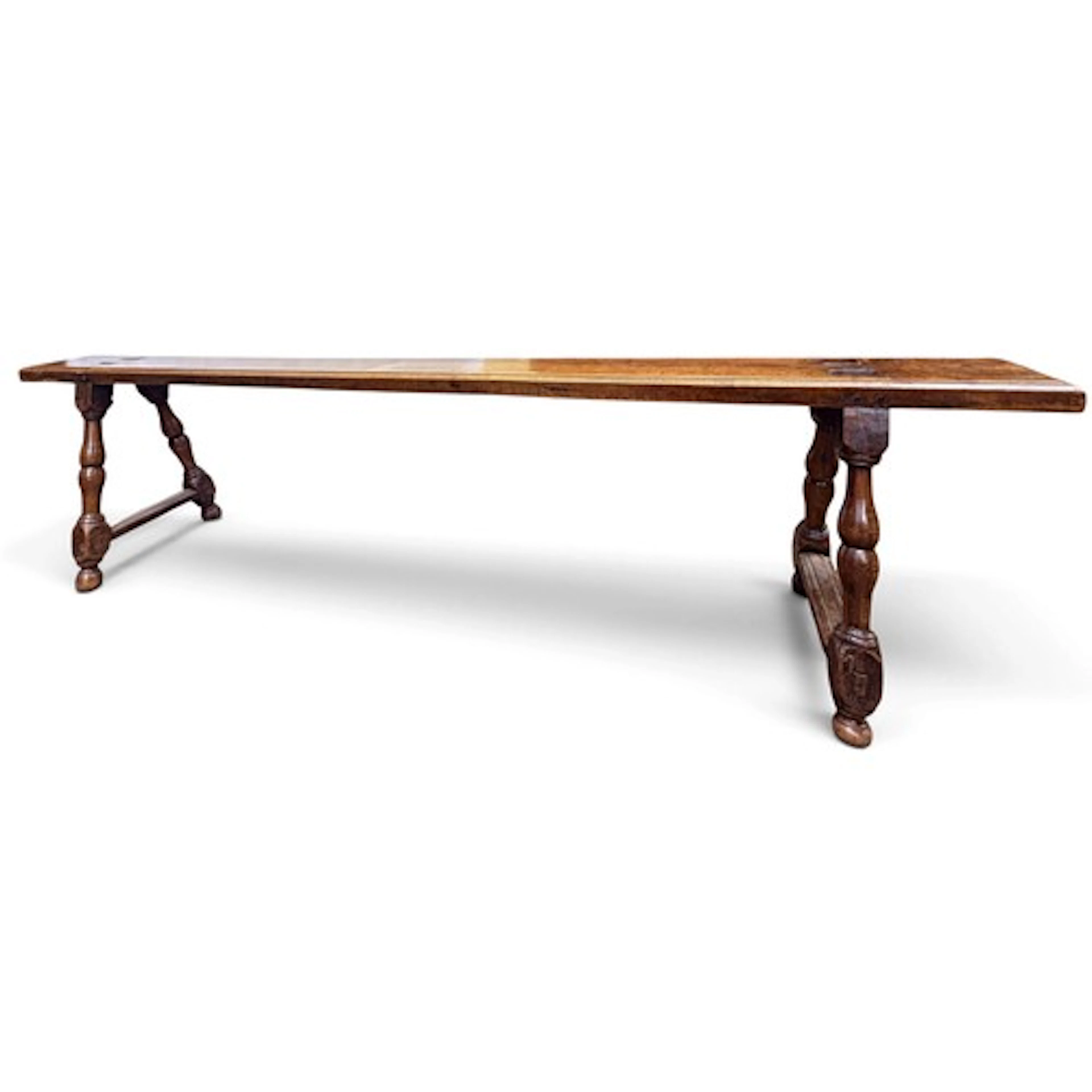 A long French walnut bench France, 18th century, the thick p...