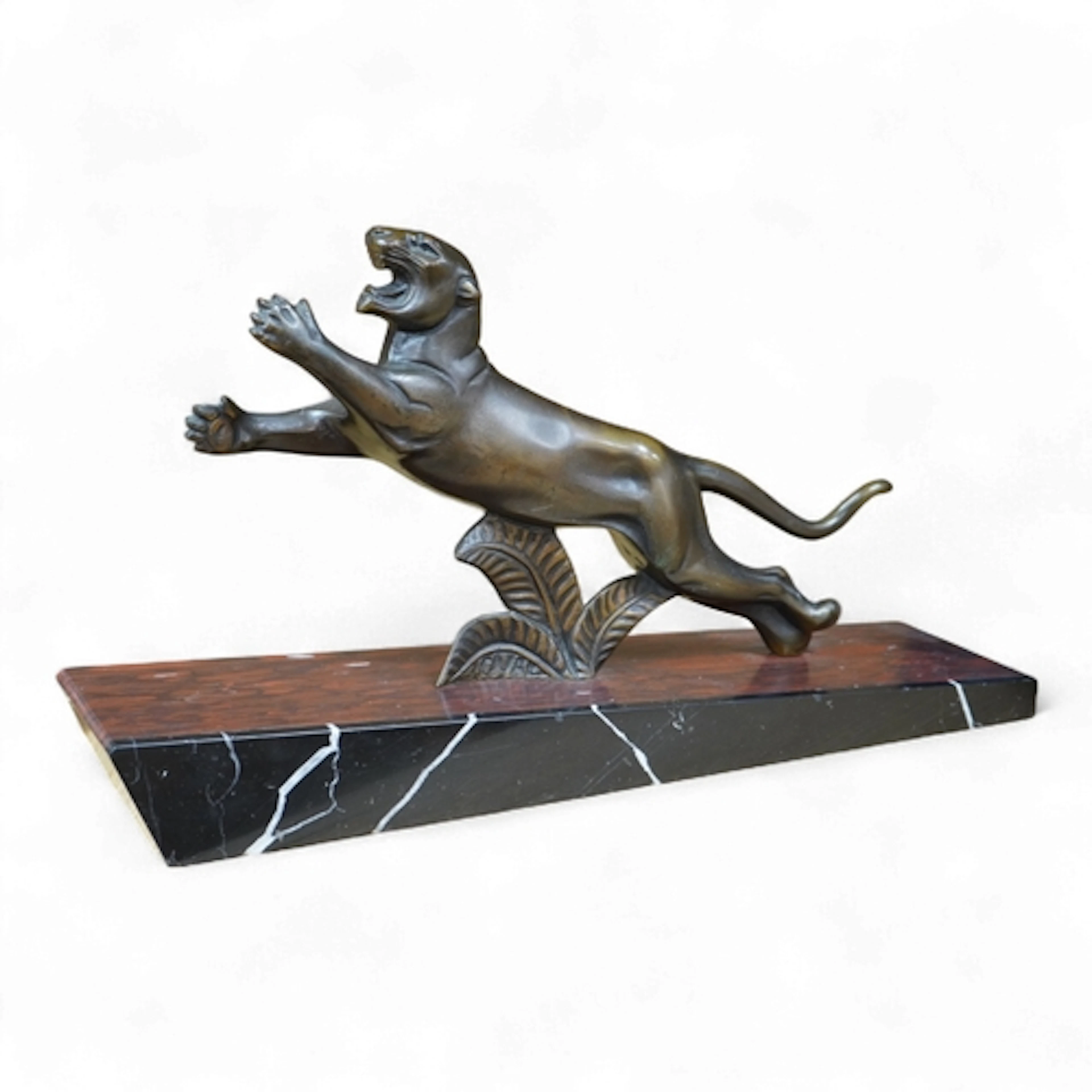A French Art Deco bronze sculpture of a panther, raised on s...